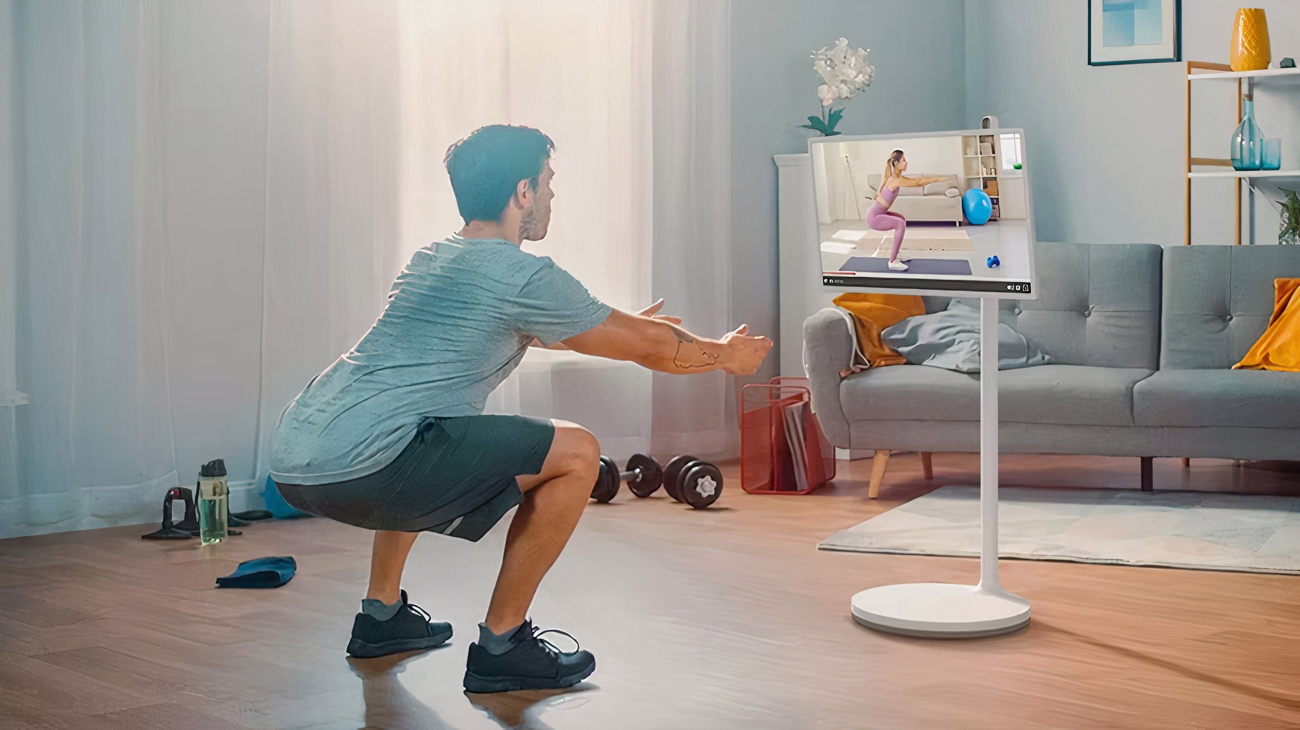 Man exercising in front of LG TV