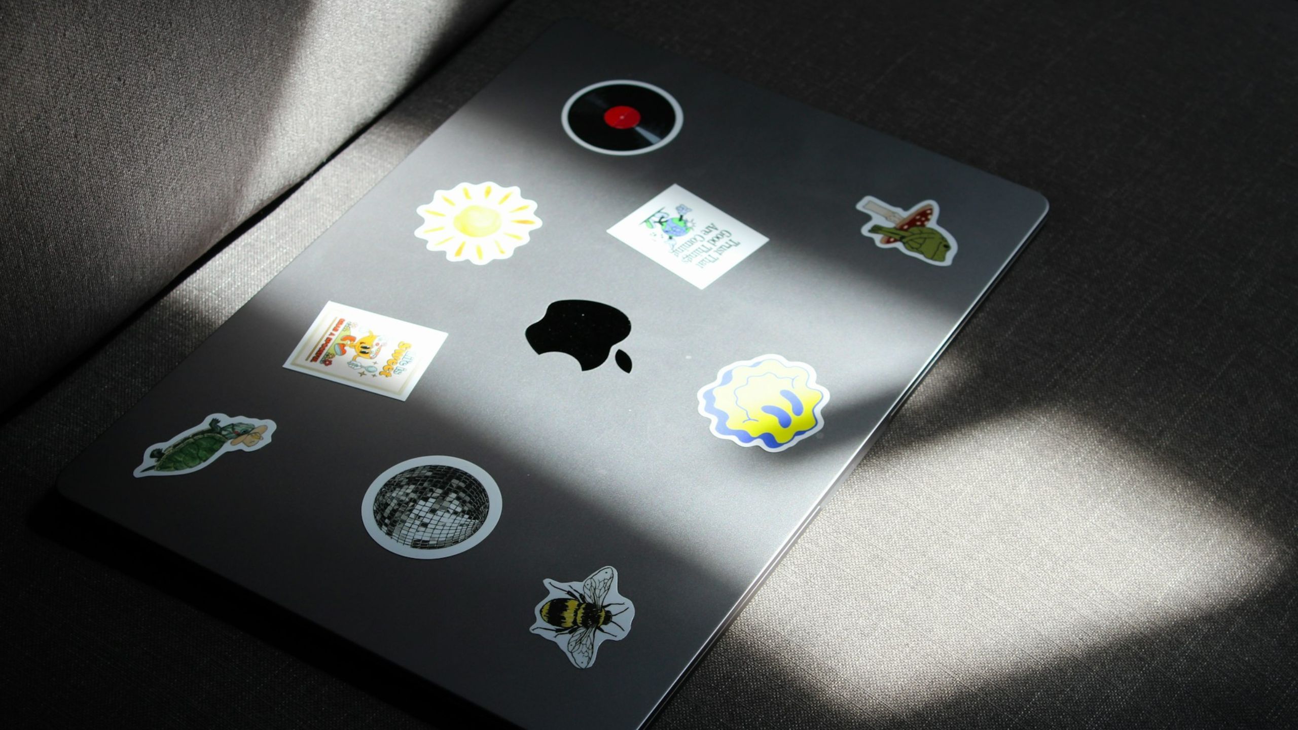 MacBook with stickers on its lid