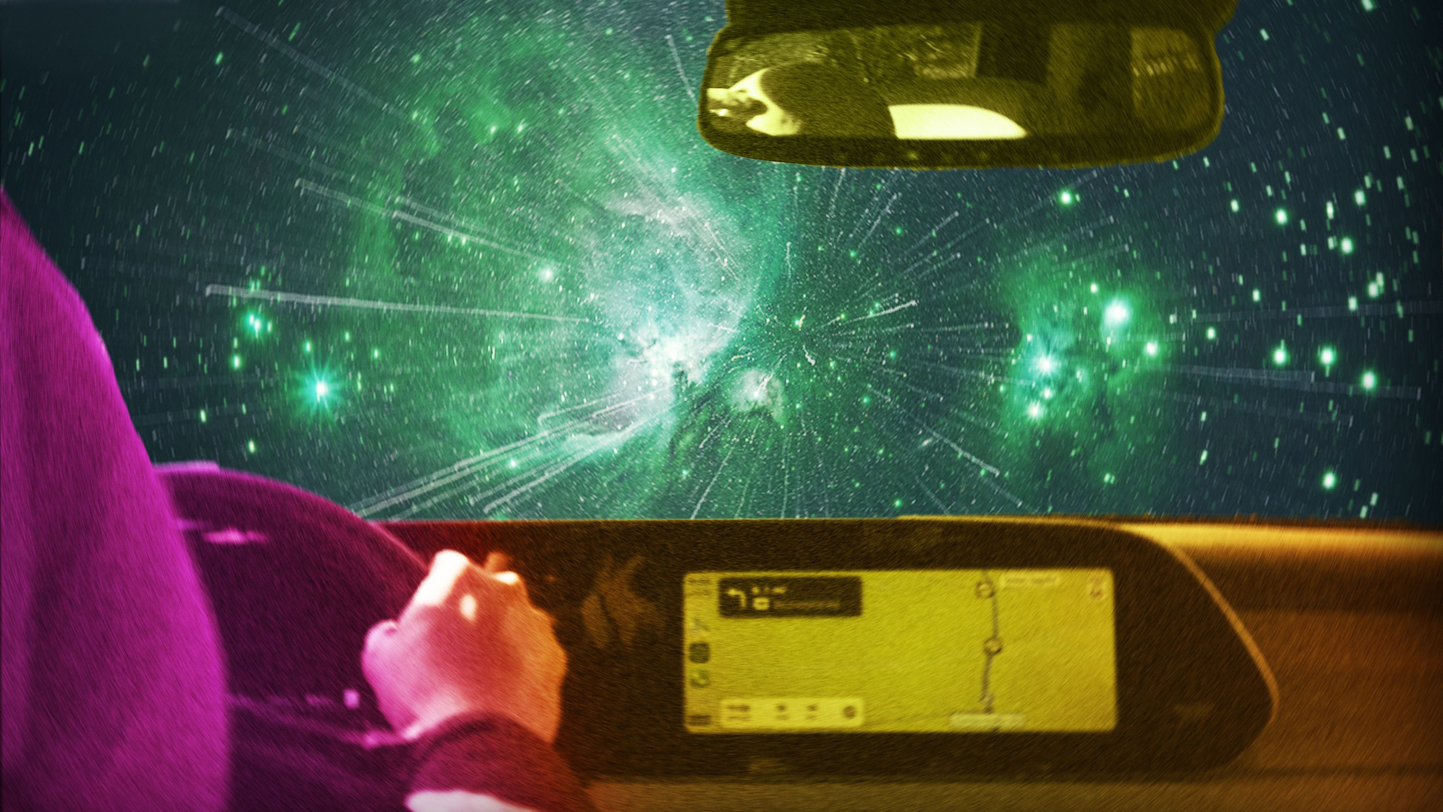 A person driving through a galaxy. 