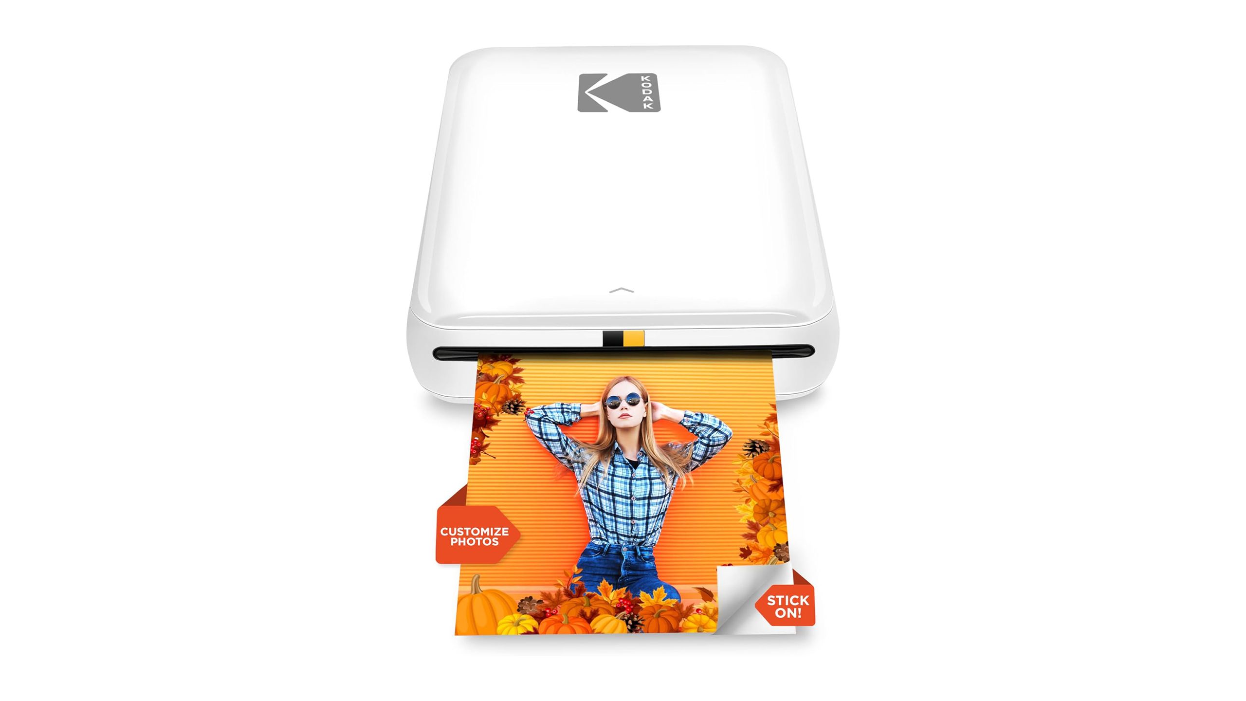 The Kodak Step photo printer with a print sticking out is placed against a white background.