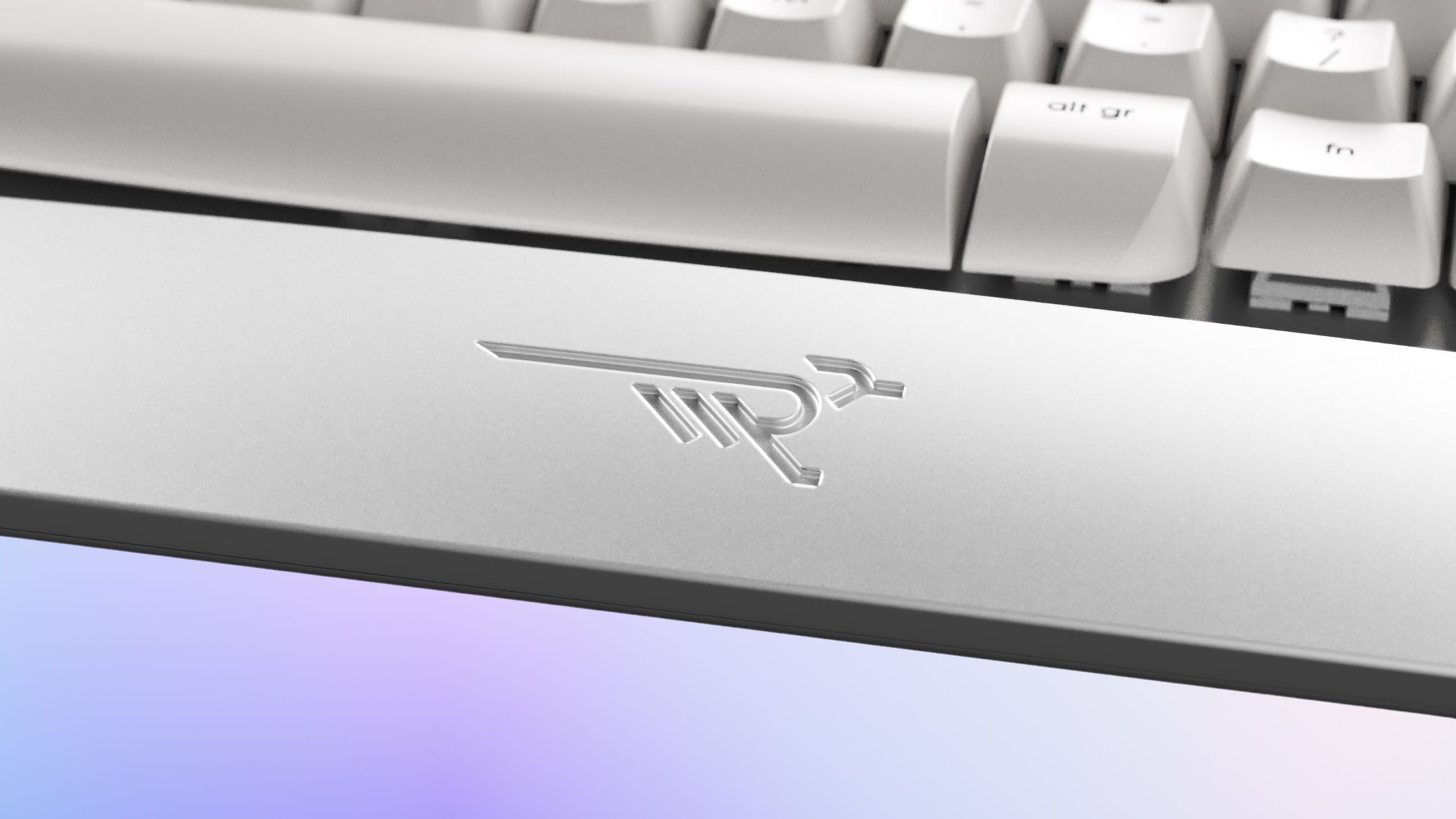 The wrist rest of the Wordrunner keyboard with a bird logo.