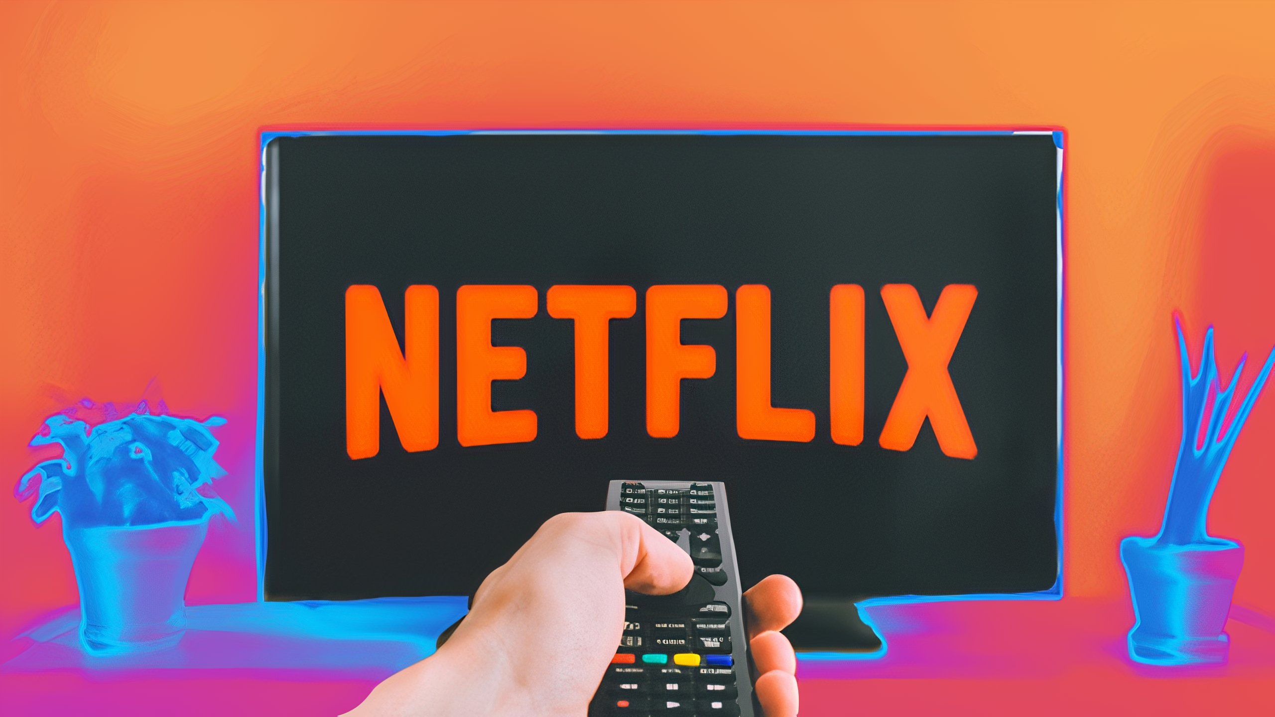 A hand pointing at the Netflix logo with a remote.