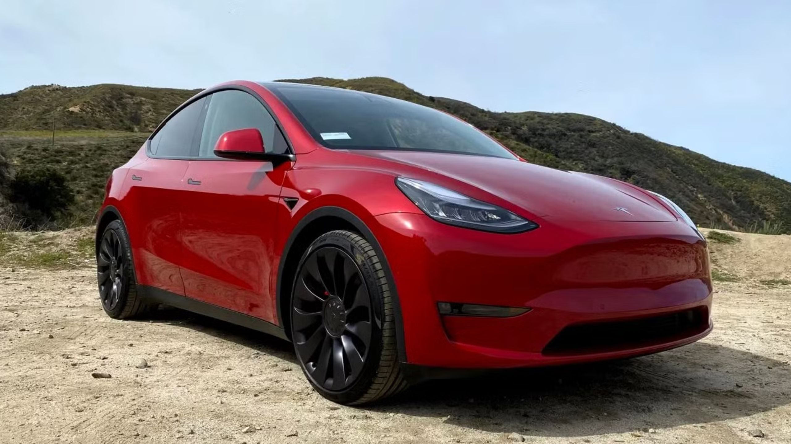 2022 tesla model y front quarter red