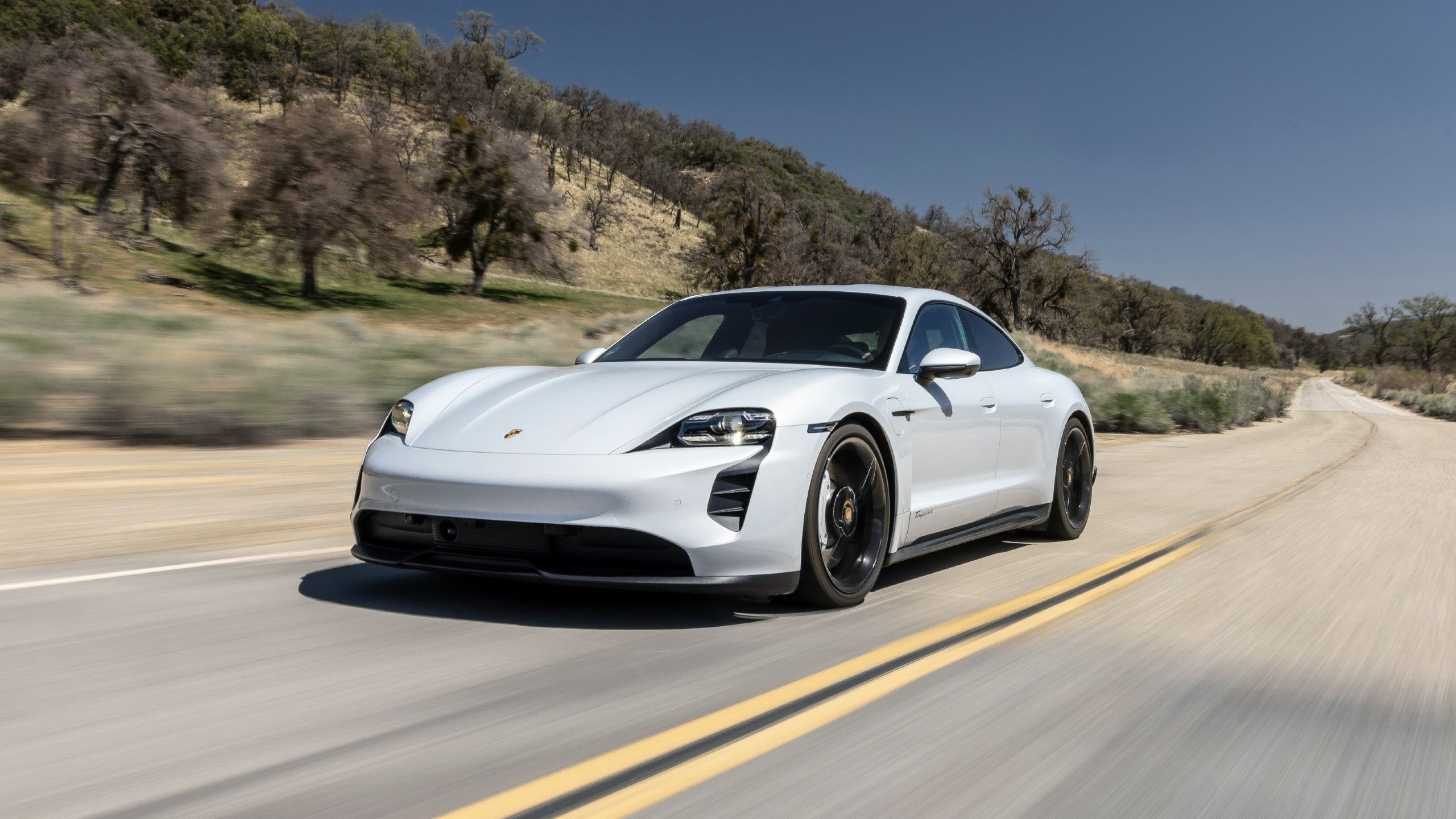 2024 Porsche Taycan front quarter driving on road