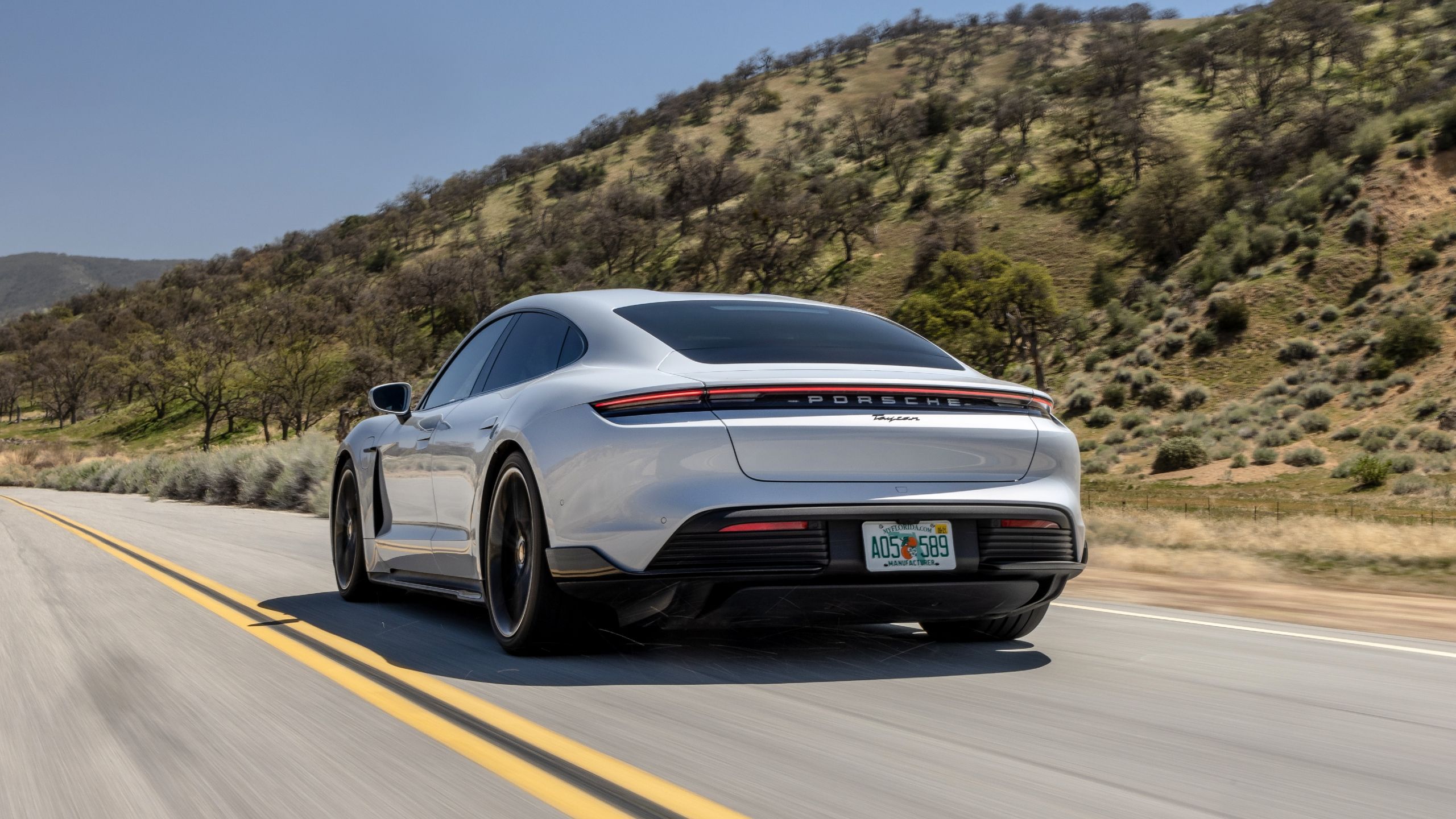 rear shot of the 2024 Porsche Taycan driving
