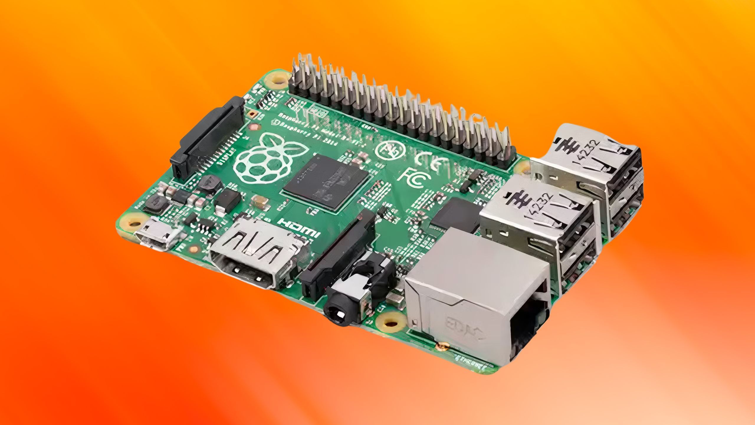 Raspberry Pi 4 Model B on an orange background. 