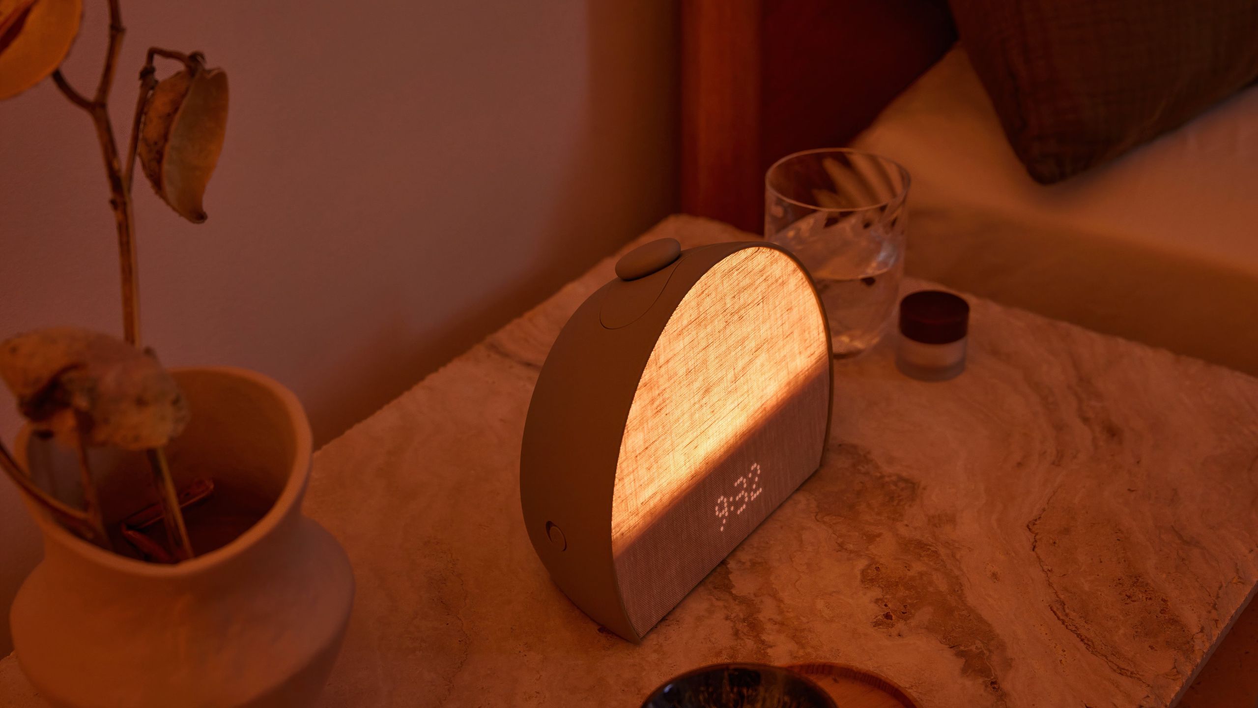 A Hatch Restore on a nightstand glowing.