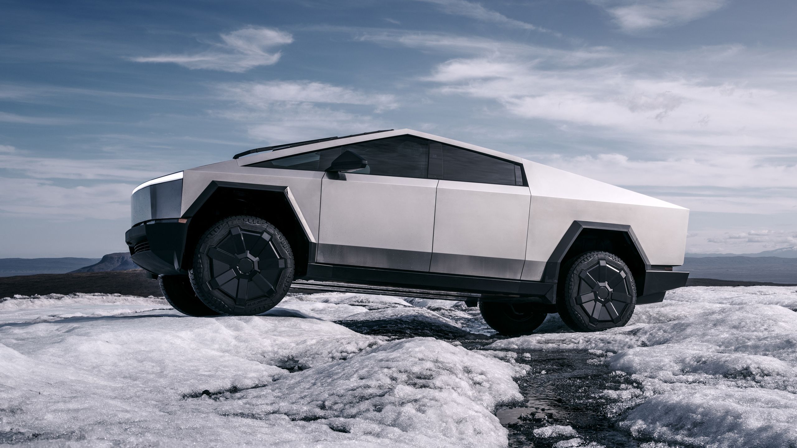 Tesla Cybertruck traversing snow.