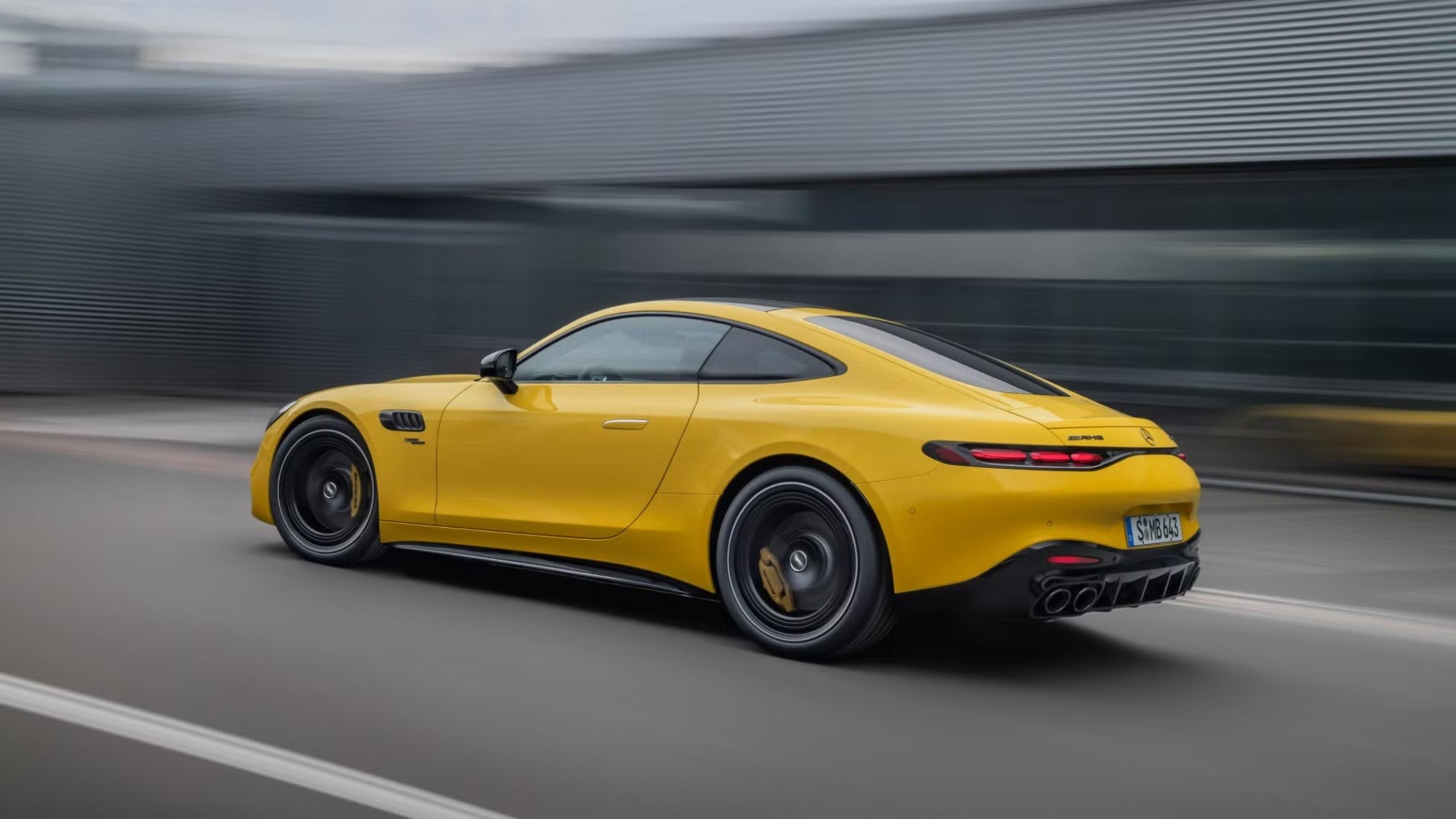 Side view of the 2025 Mercedes-AMG GT 55 coupe driving