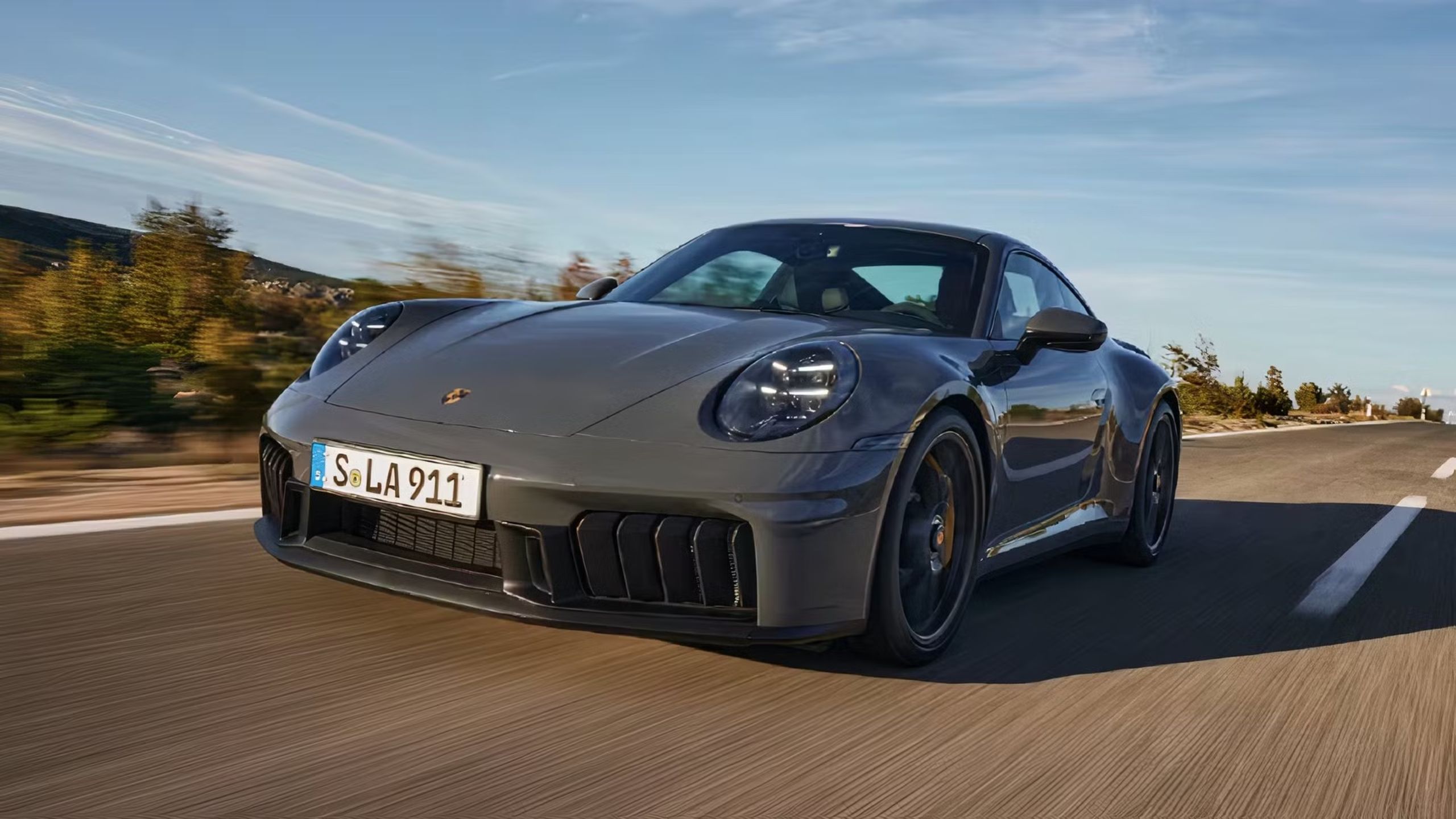 Front view of the 2025 porsche 911 driving