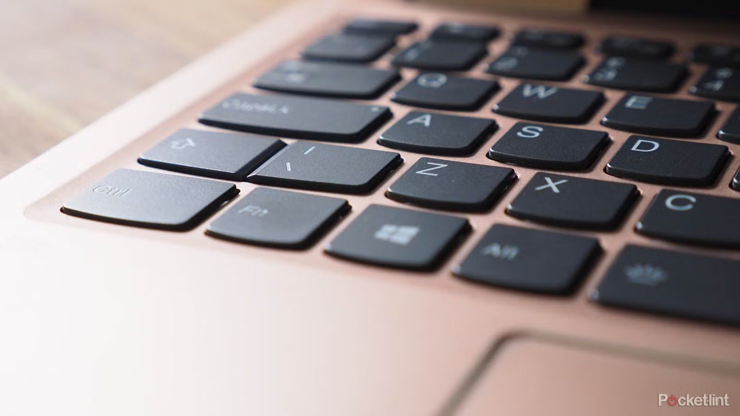 A closeup on a rose gold keyboard. 