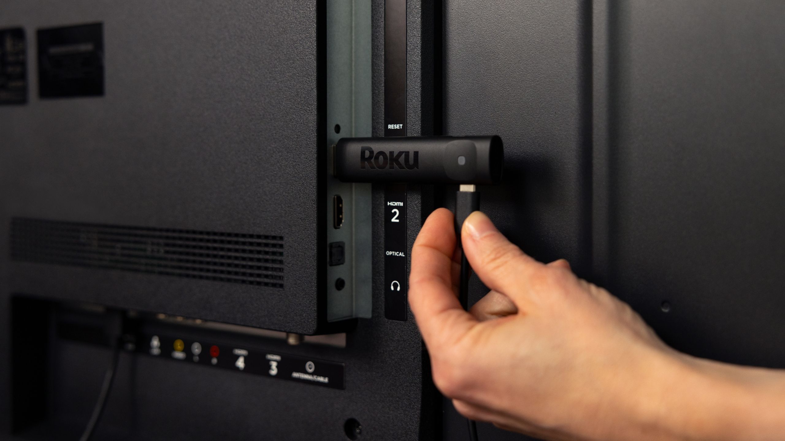 Roku Streaming Stick being plugged in