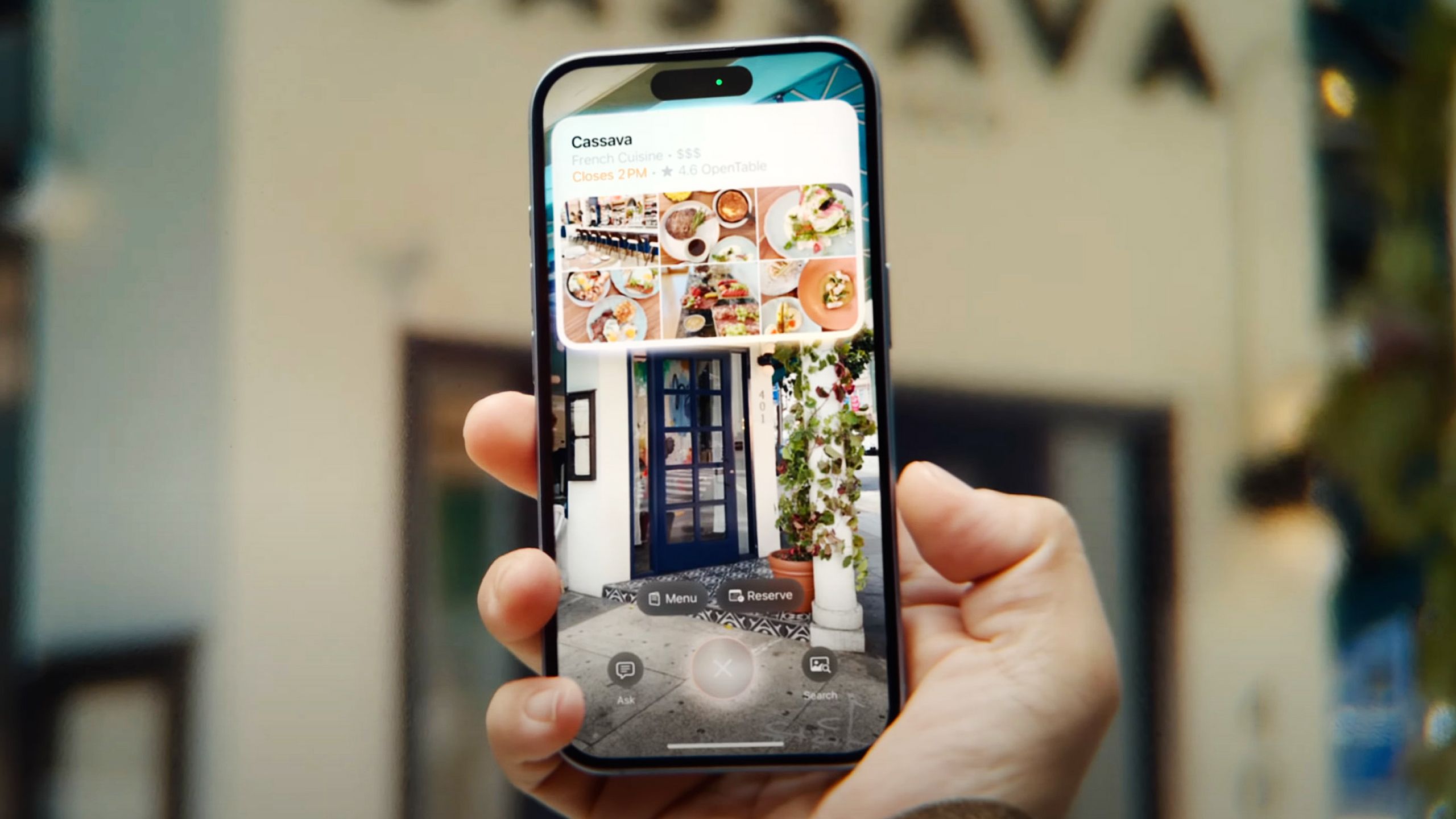 Scanning a restaurant with Visual Intelligence on an iPhone 16.