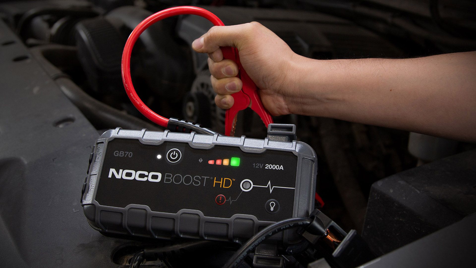 NOCO BOost HD being fitted to a battery.