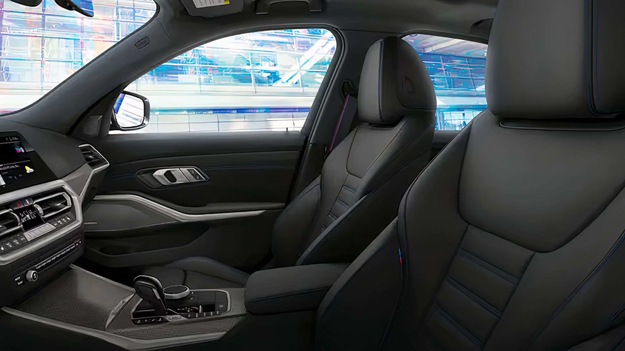 A still photo of a black leather trimmed 2021 BMW 3-Series interior.