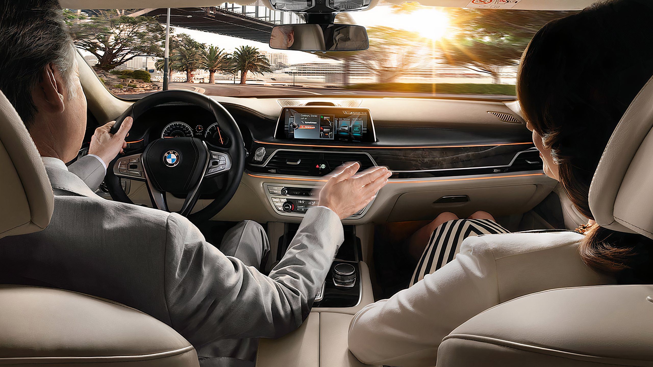 A BMW driver uses the gesture control built into his infotainment display. 