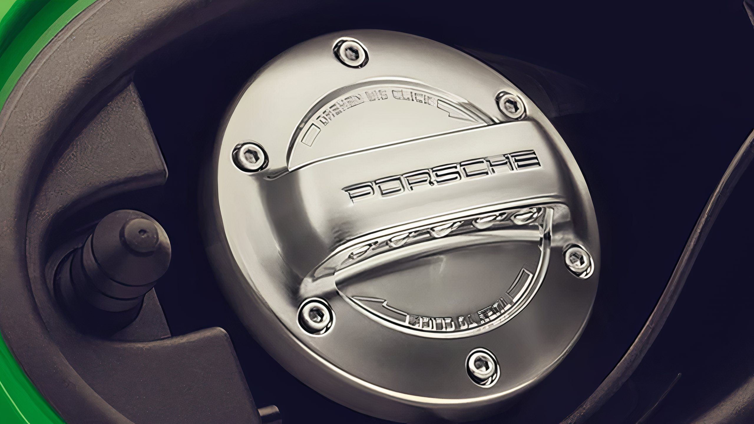 A still photo of a Porsche fuel filler cap. 
