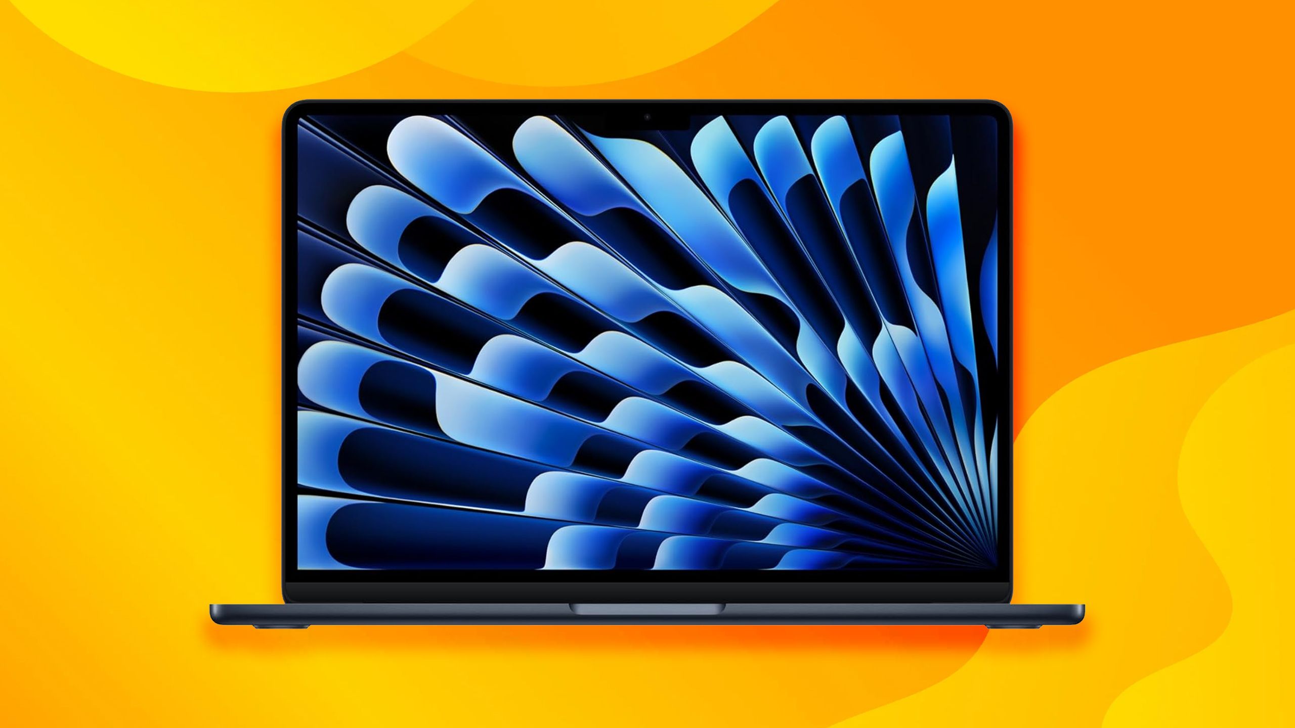MacBook Air on yellow/orange background.