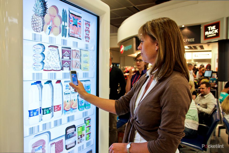 tesco trials interactive virtual store at gatwick airport for holidaymakers to pre order groceries image 1