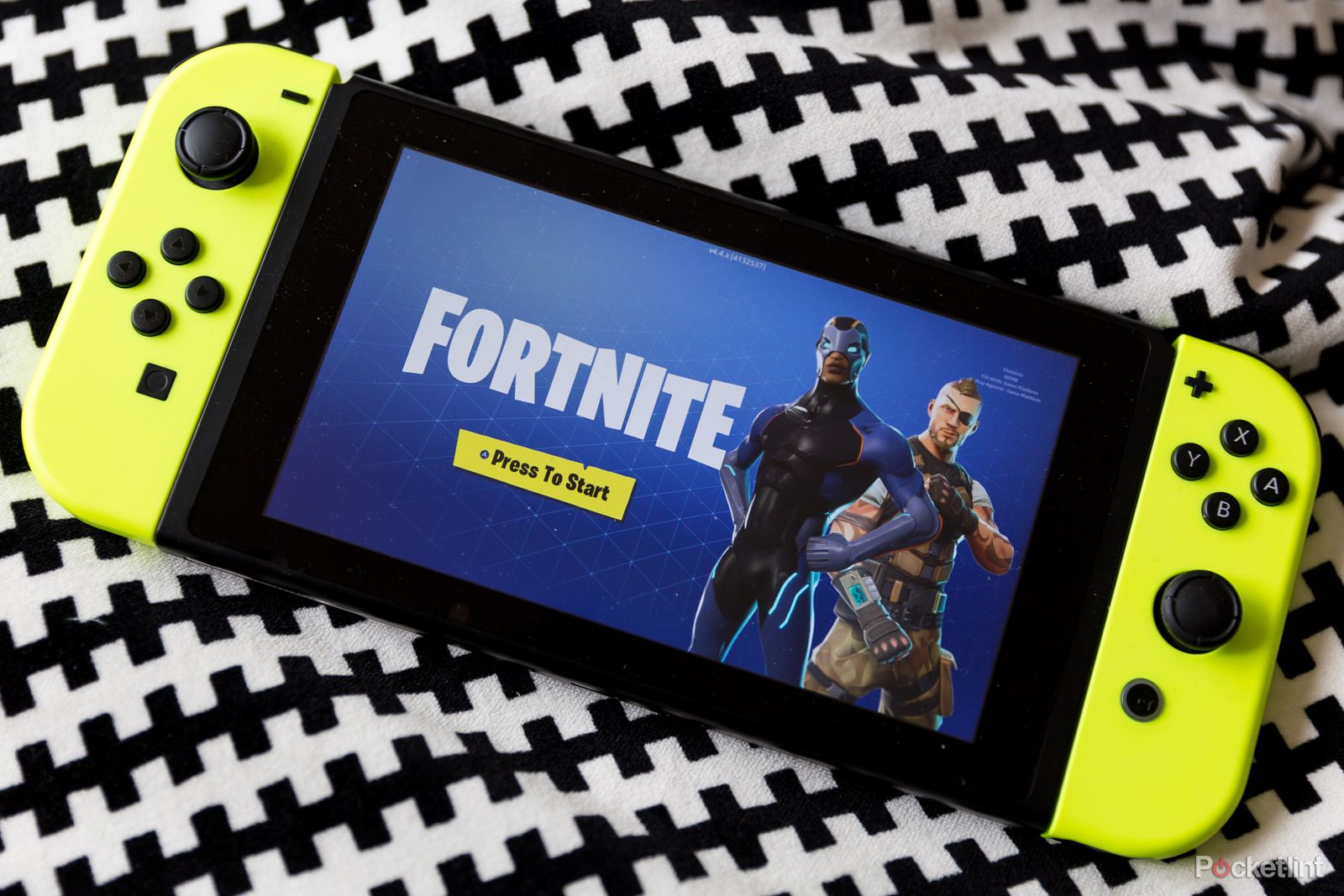Fortnite loading screen on a Nintendo Switch with yellow Joy-Cons