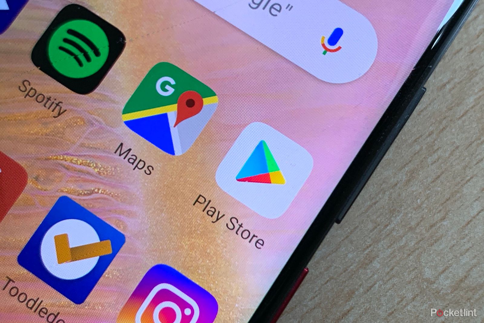 Google Play Store icon on a phone screen