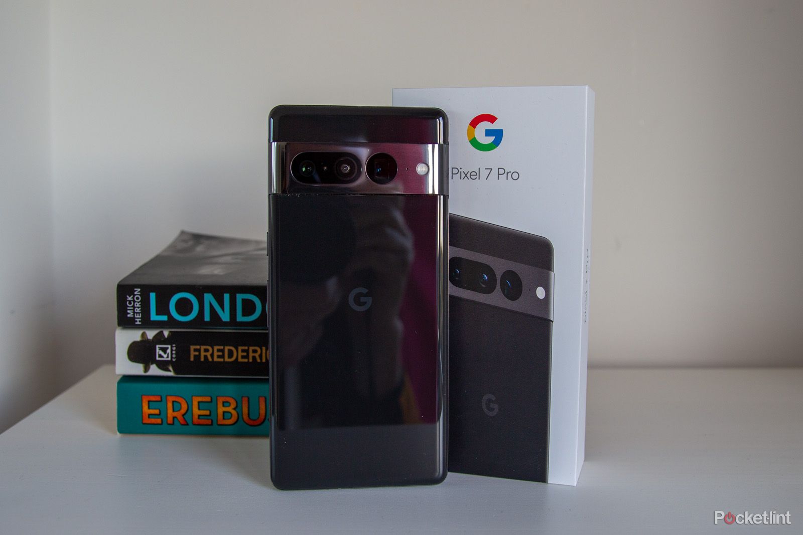 Google Pixel 7 Pro in black leaning against its box