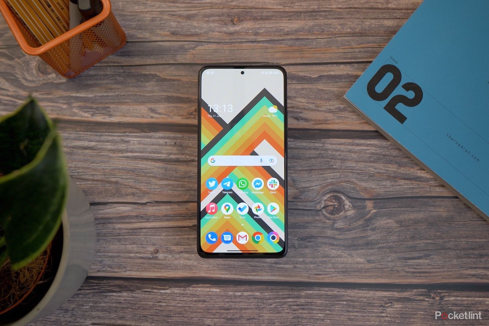 Poco phone on a wood desk