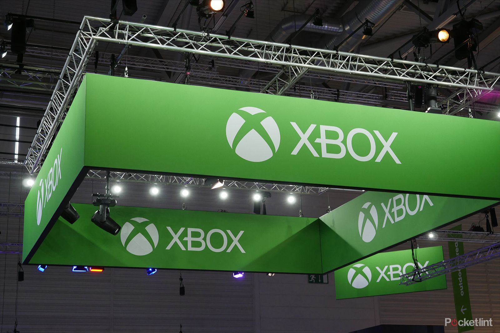 Xbox logos hanging from the ceiling at a trade show