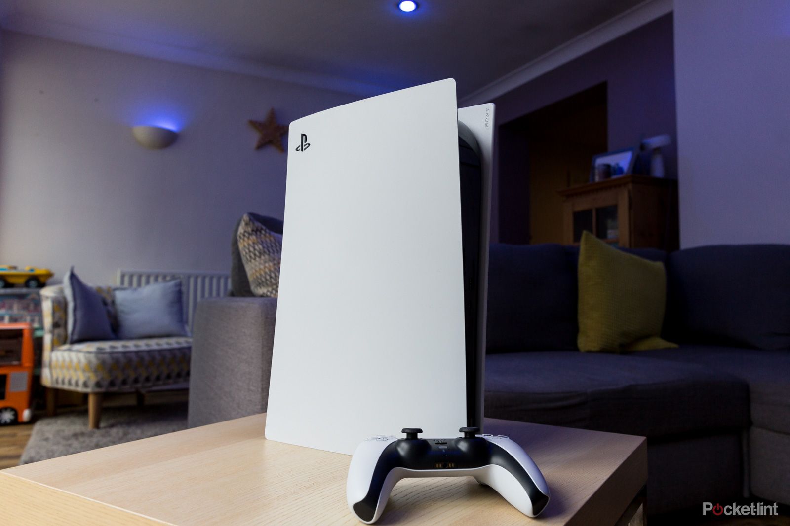 PS5 stood vertically on a table