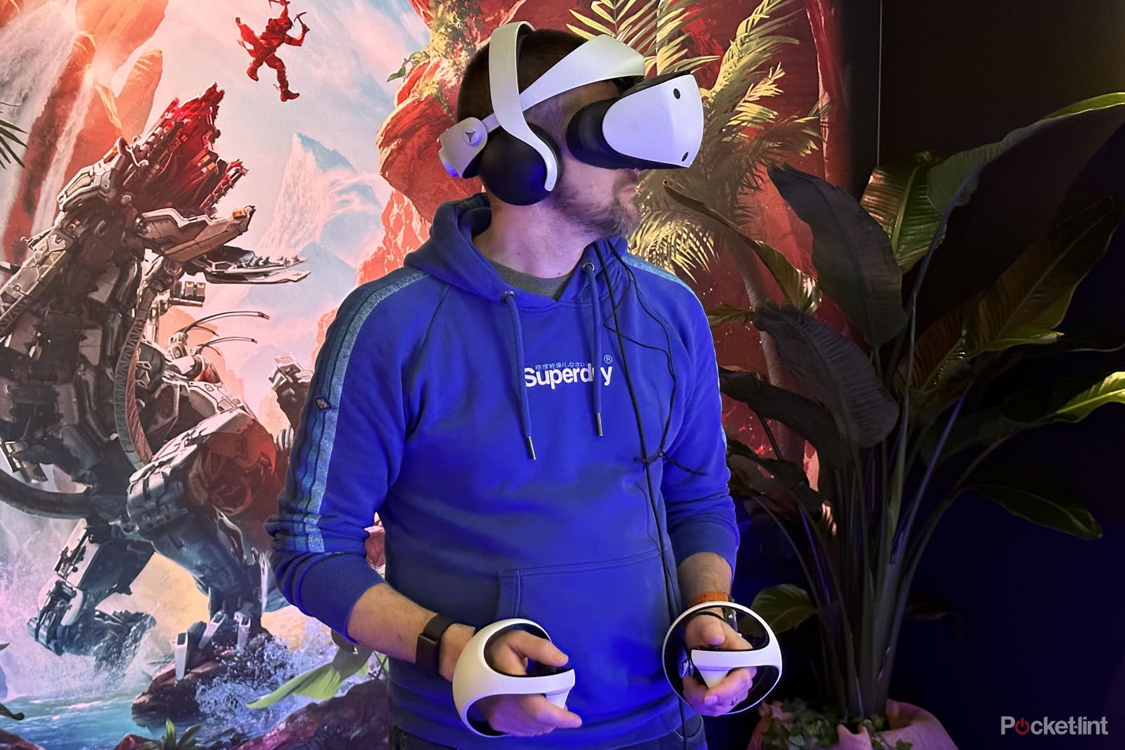 Man playing a PlayStation VR2 game wearing the headset