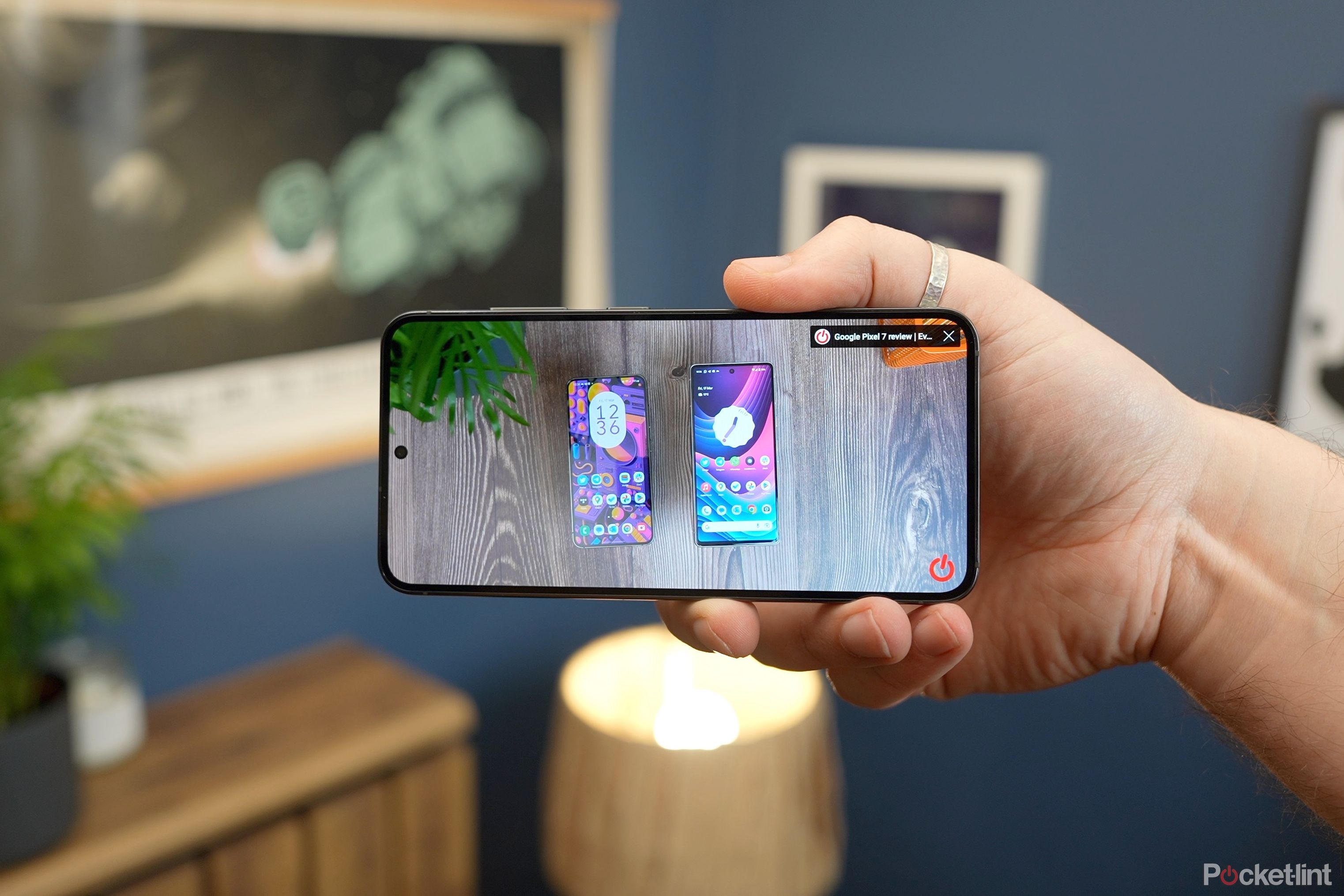 Samsung Galaxy S23 display in hand blurry background