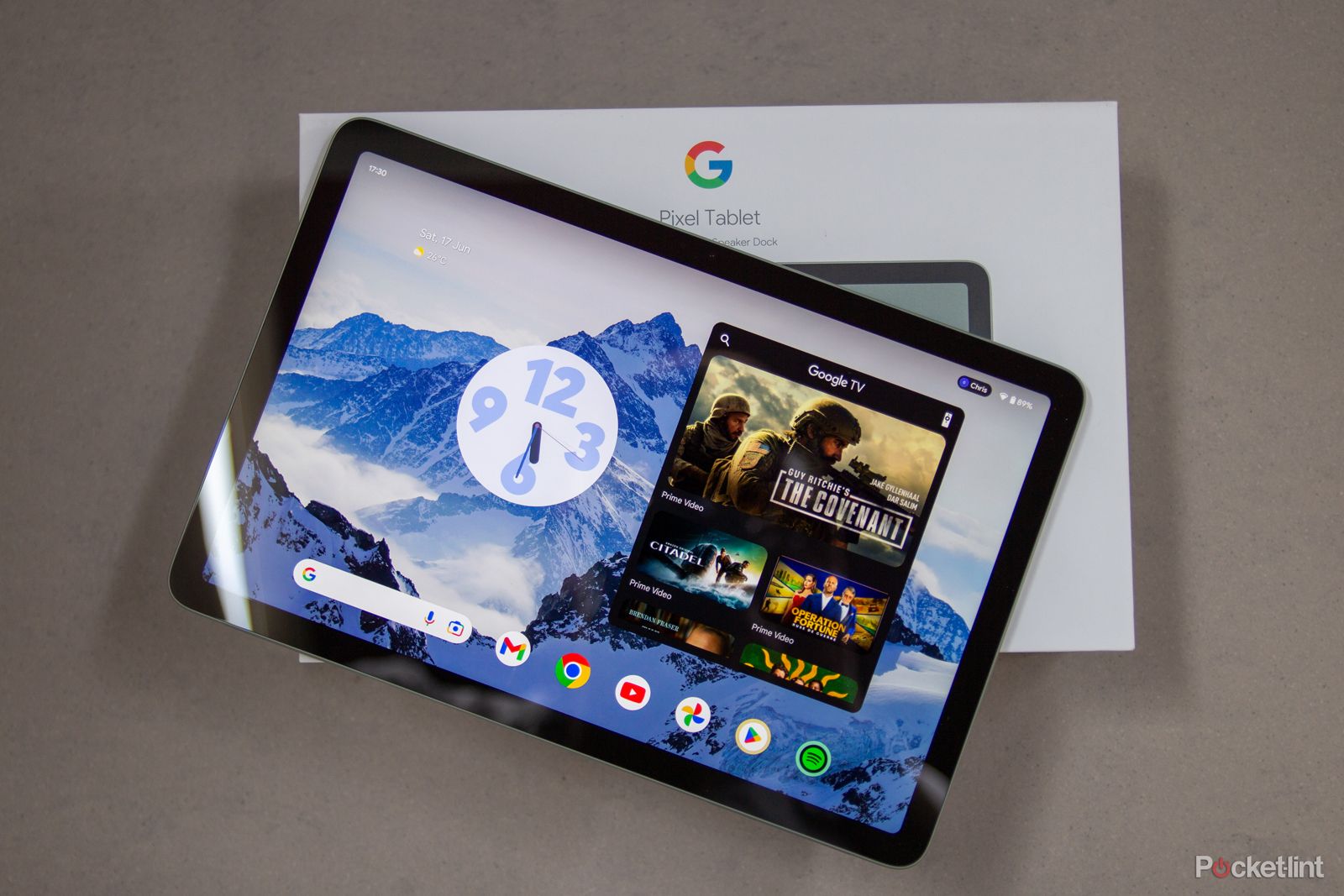 Google Pixel Tablet against a colorful gradient background. 
