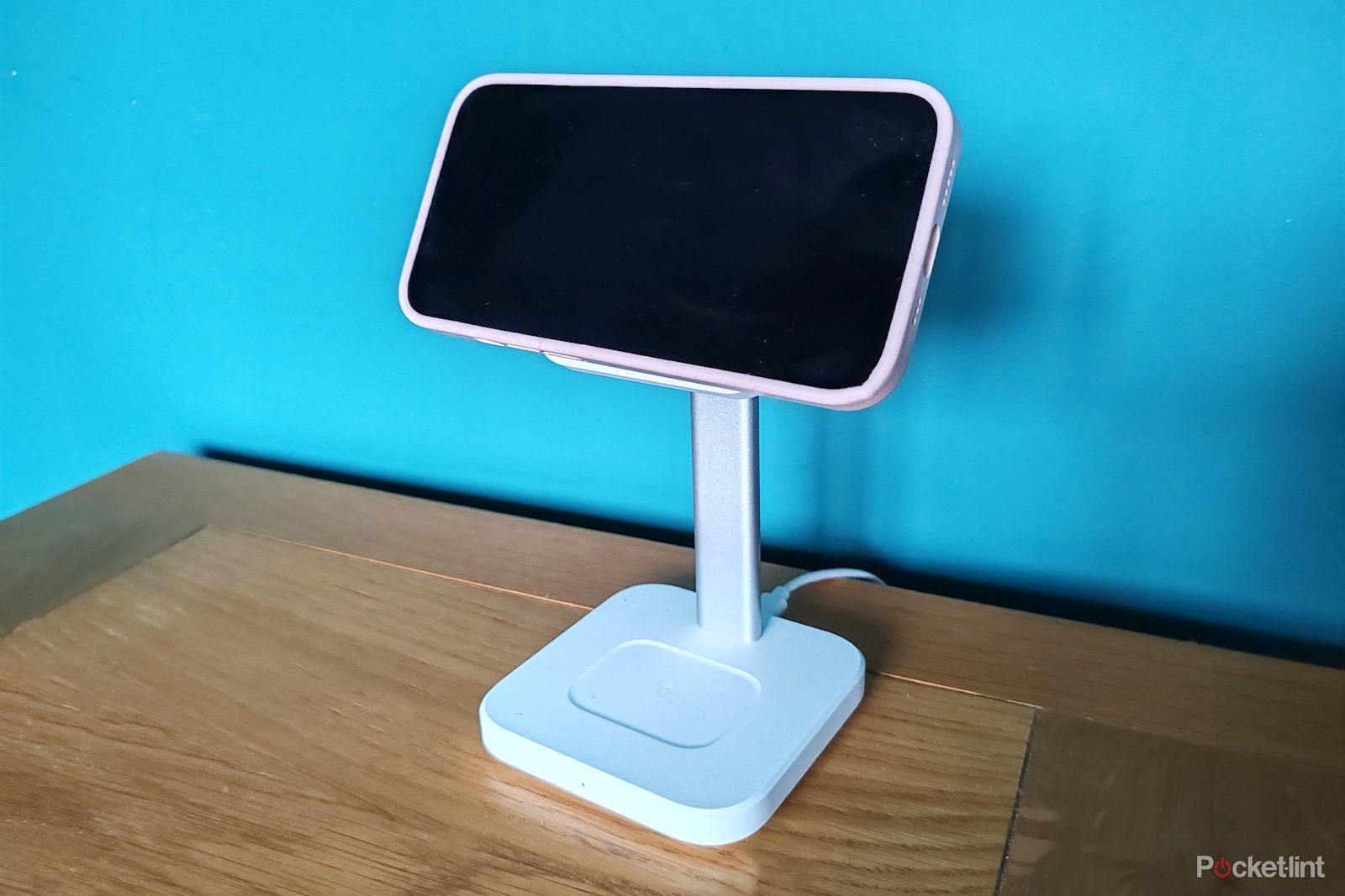 ESR HaloLock 3-in-1 wireless iPhone charger stand holding iPhone in landscape