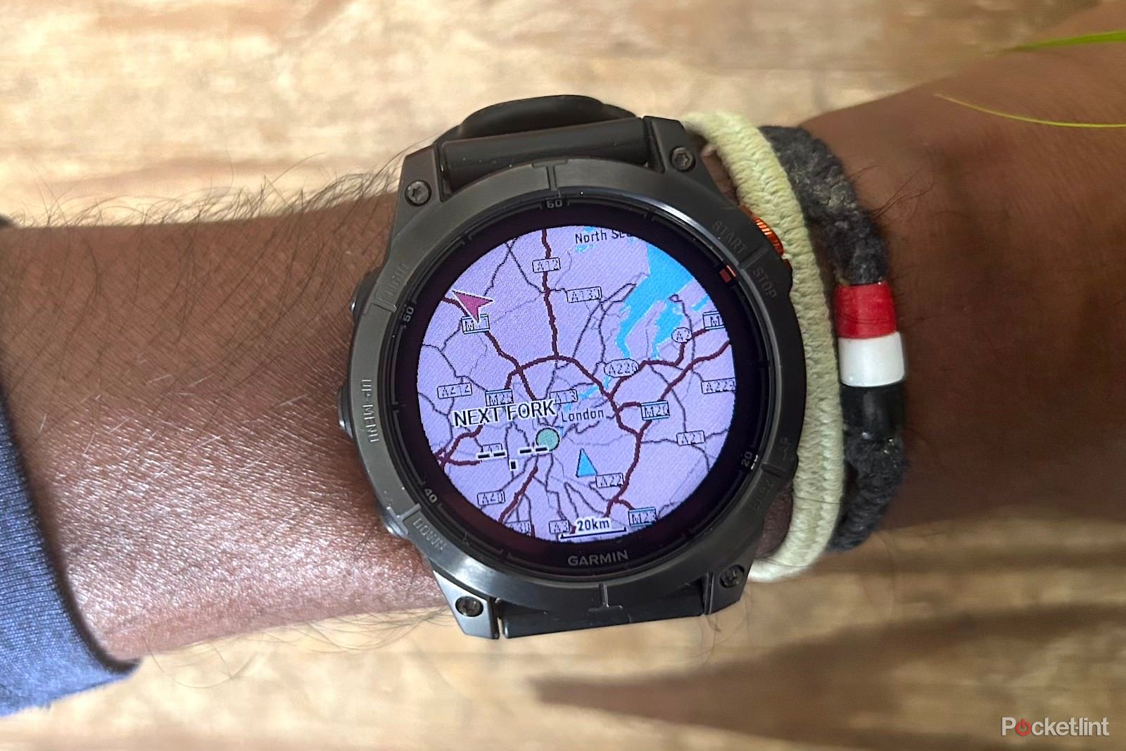 Garmin Fenix 7 Pro on wrist with screen displaying maps
