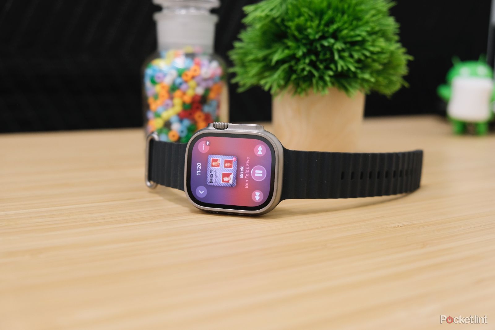 An Apple Watch running WatchOS 10 showing the new now playing screen.