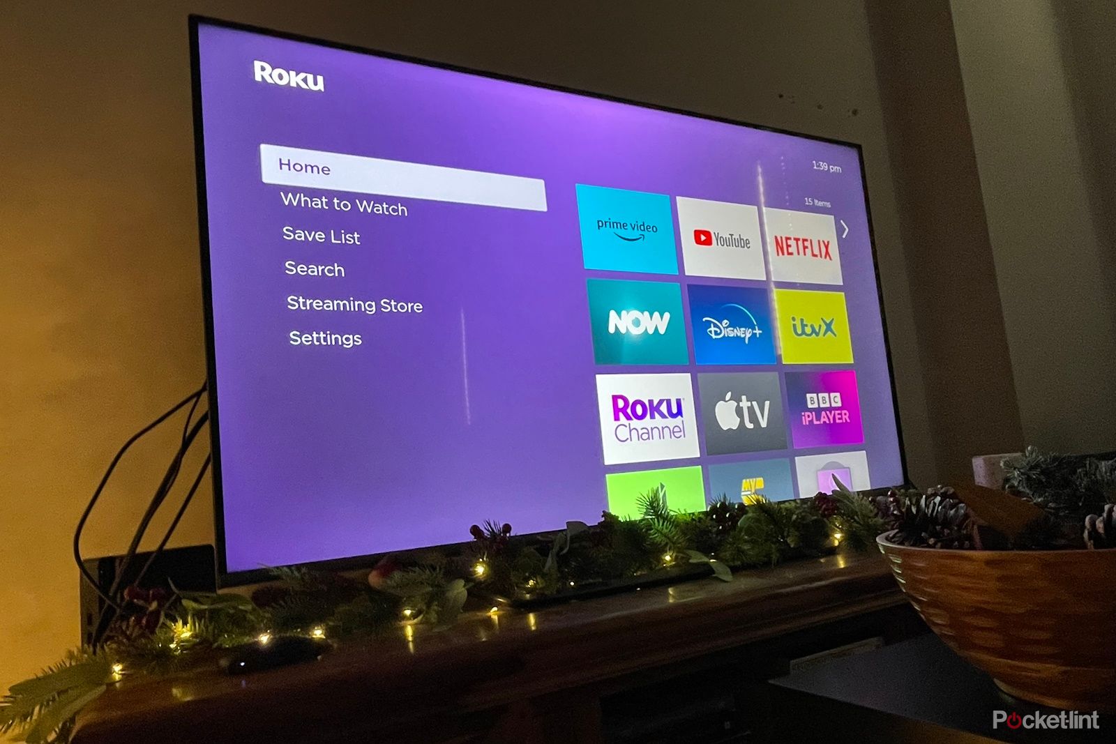 Roku device plugged into TV on home screen