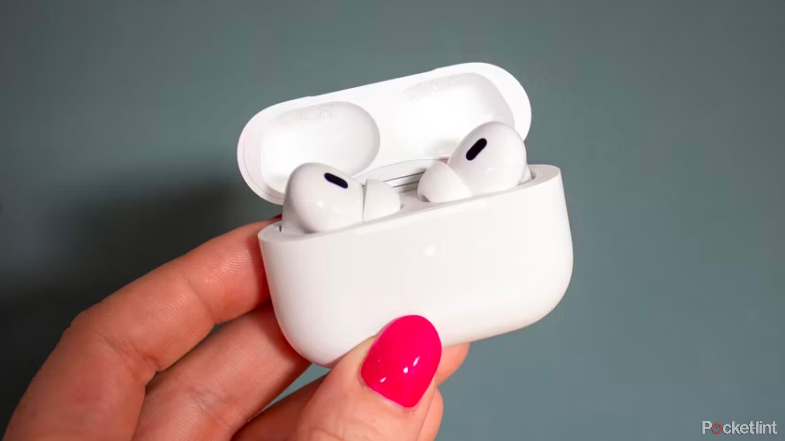 AirPods being held