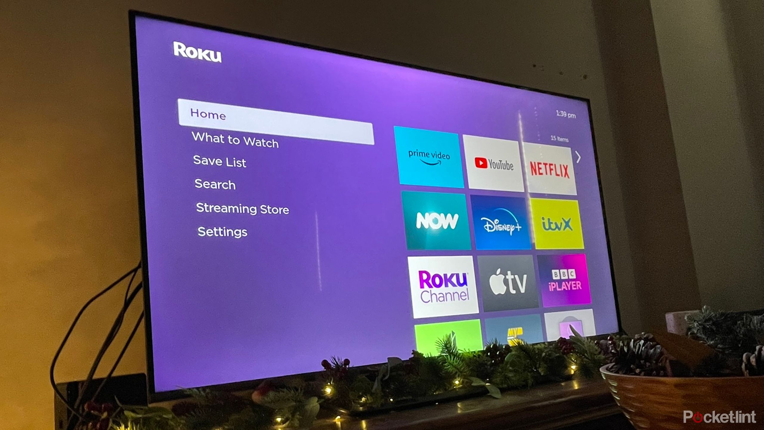 HiSense TV with Roku Express 4K streaming stick showing Roku home screen