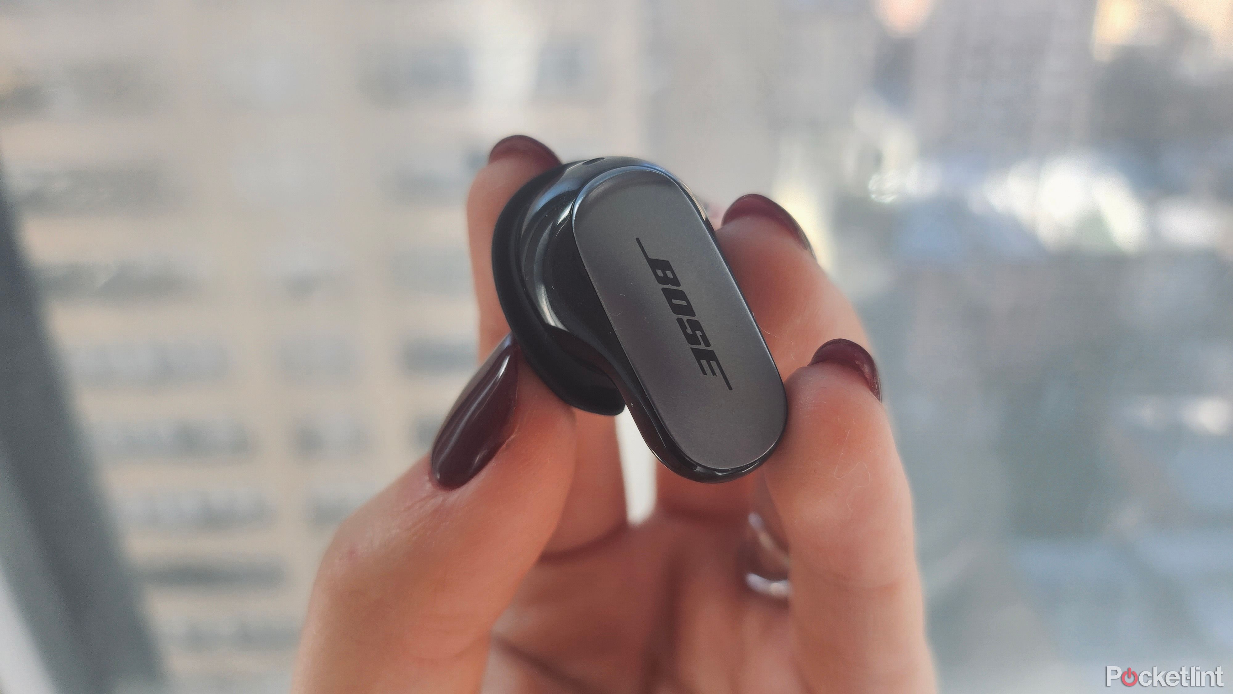     Bose QC Ultra earphone in hand