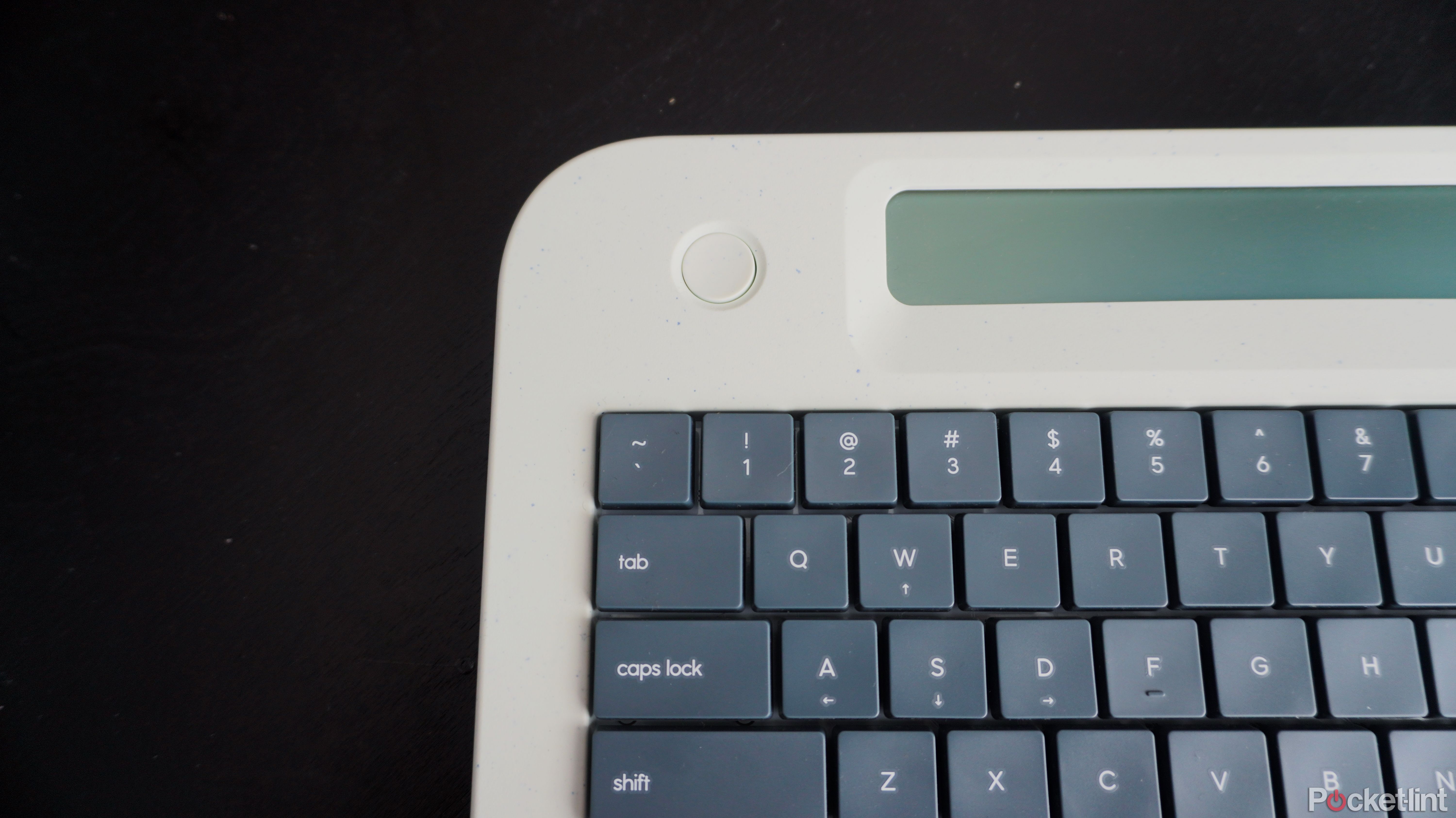 The top left corner of the Freewrite Alpha with power button and keys visible.