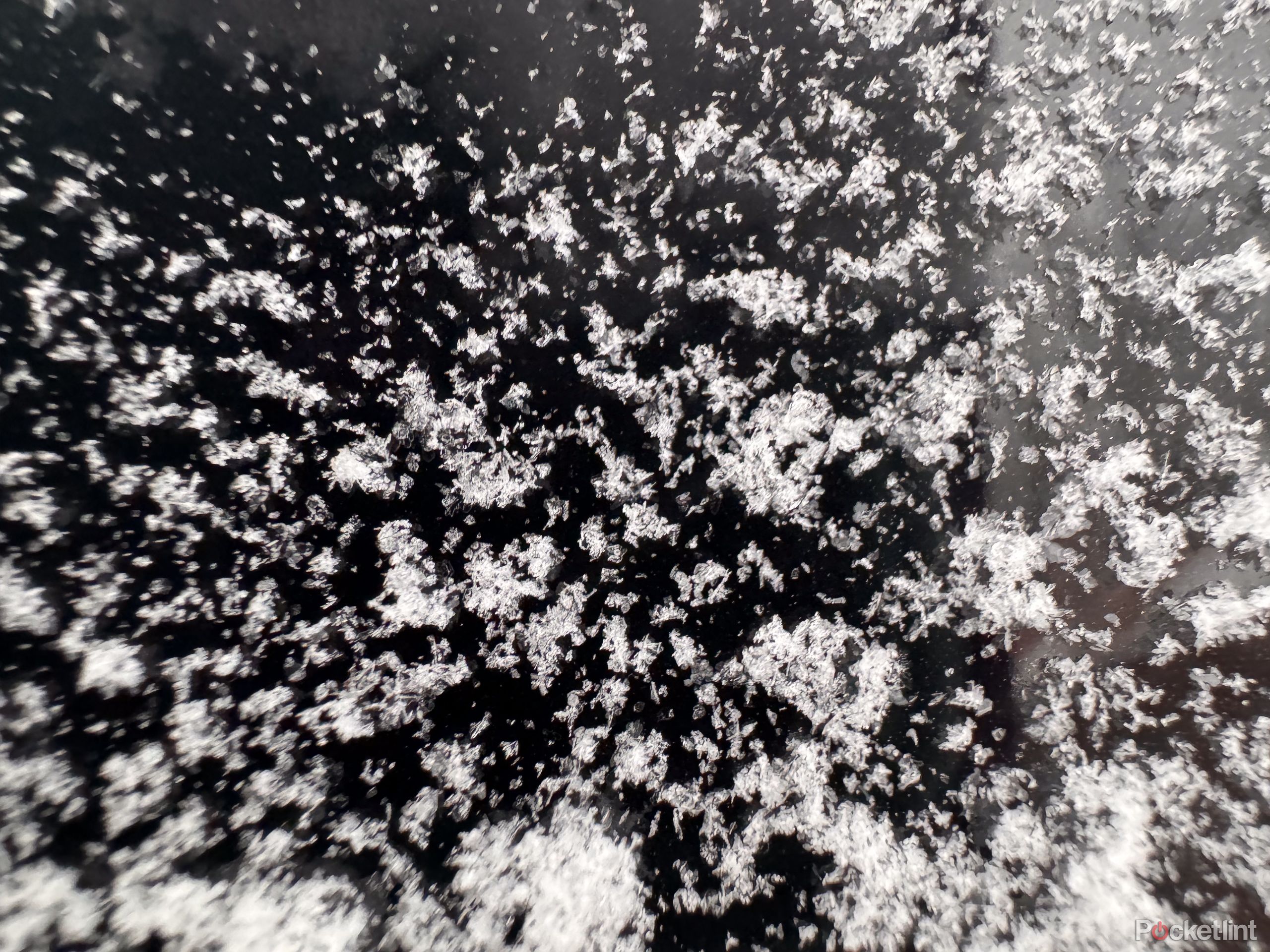 Snow on a black background, iPhone 15 Pro image sample