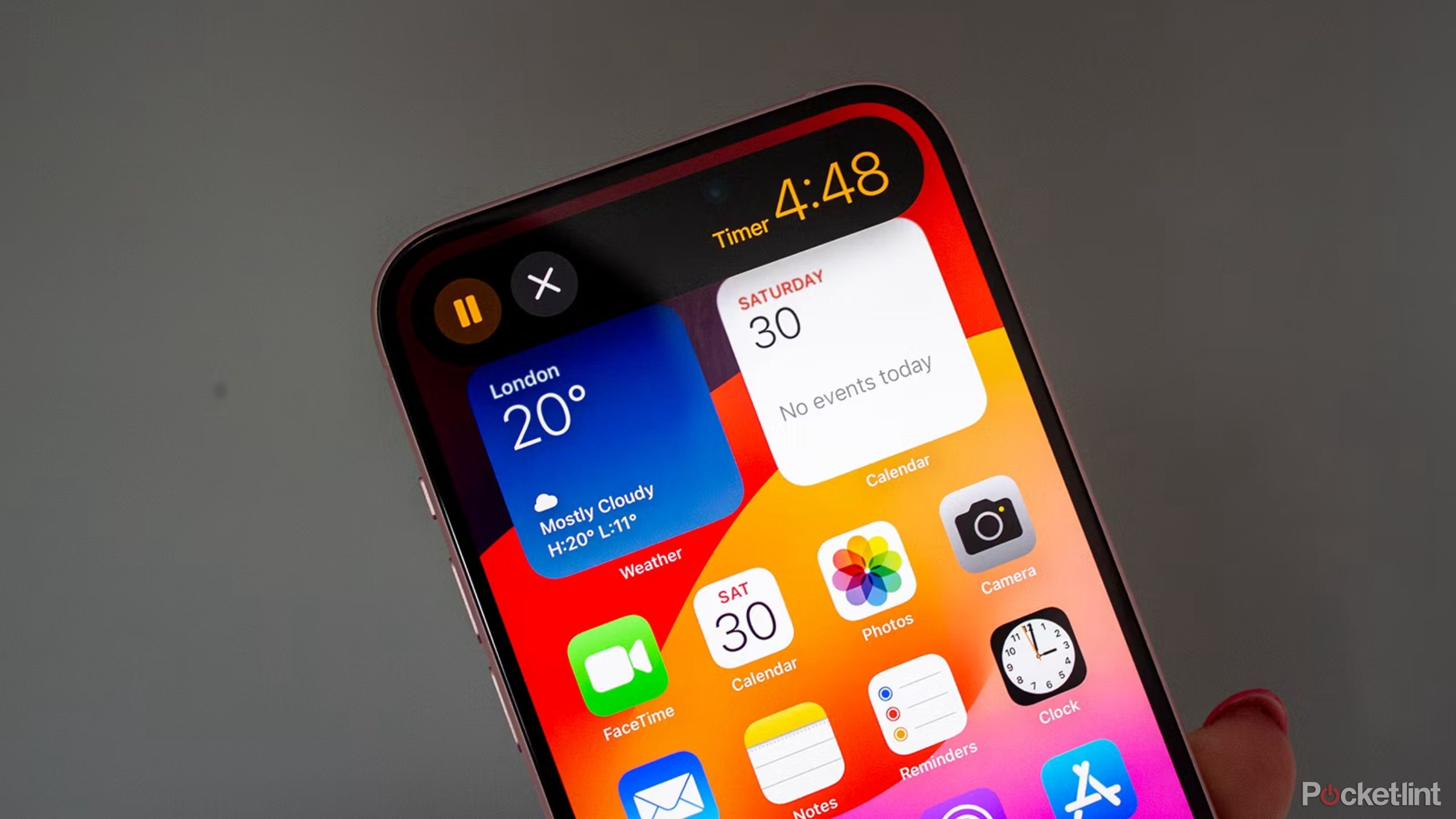 A dynamic island timer on the iPhone 15 Plus