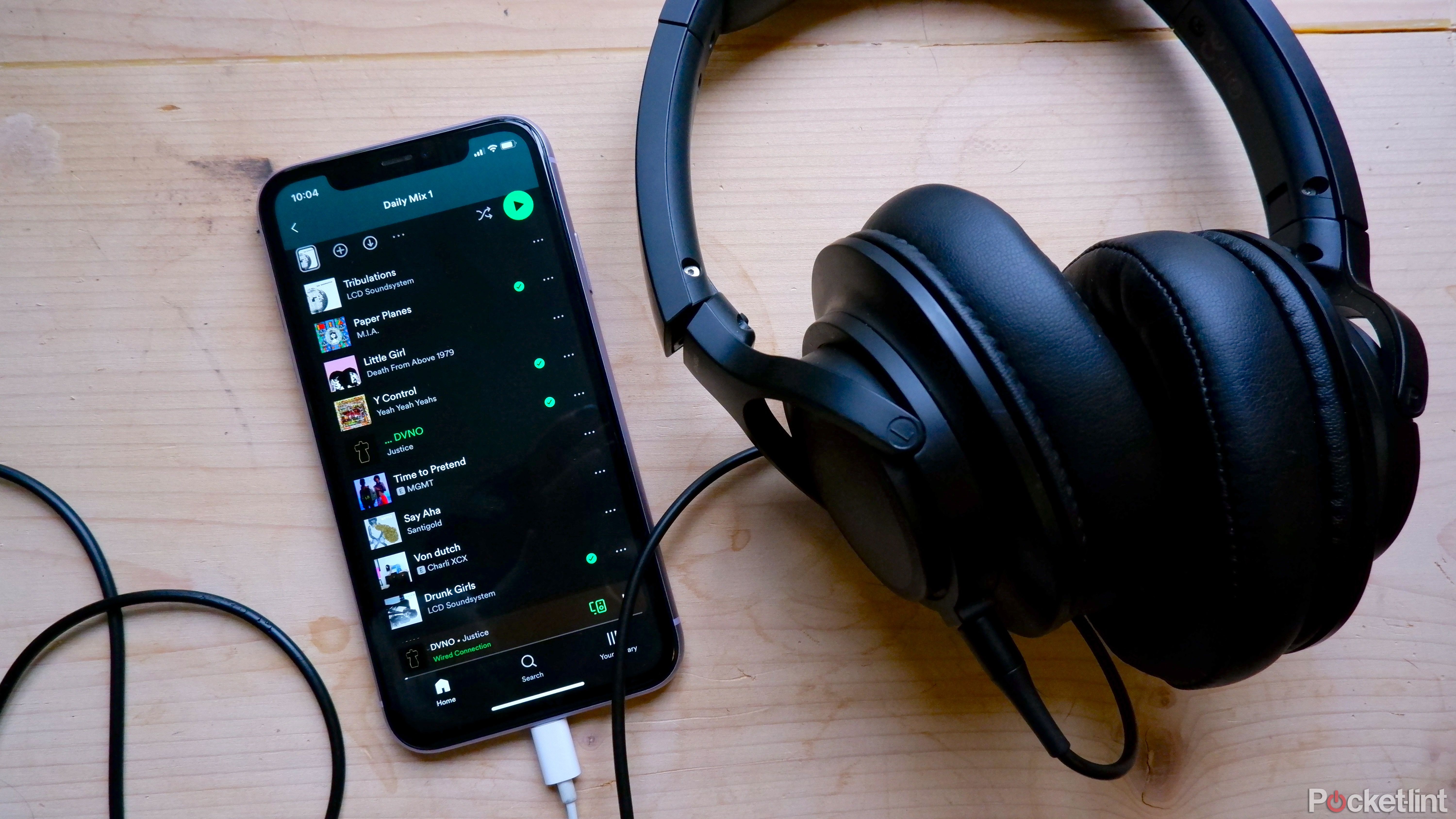 With Spotify open, plug in headphones to your iPhone.