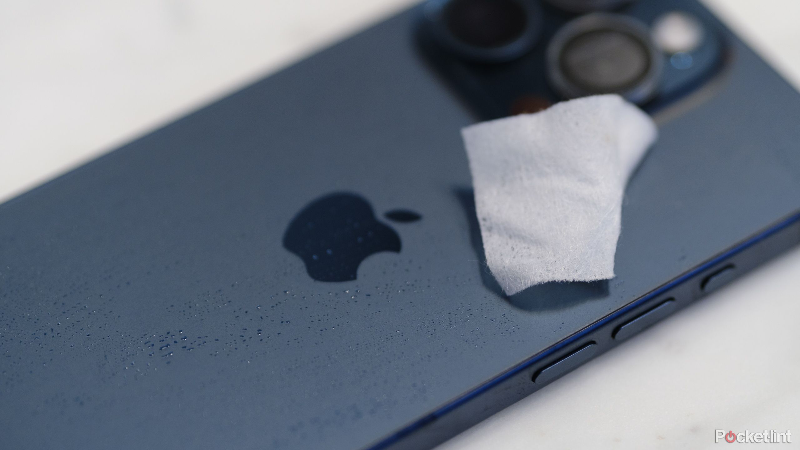 A photograph of a cleaning wipe on an iPhone