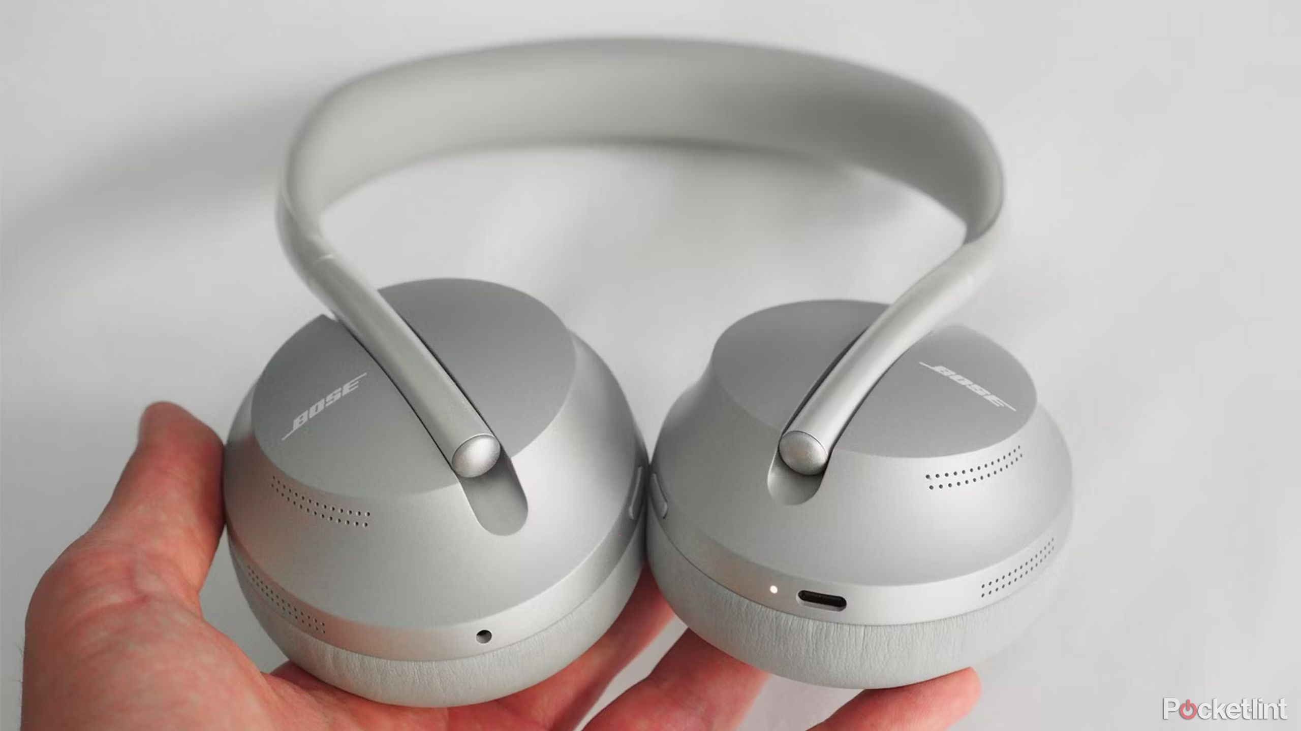 Bose NCH 700 in hand in silver. 