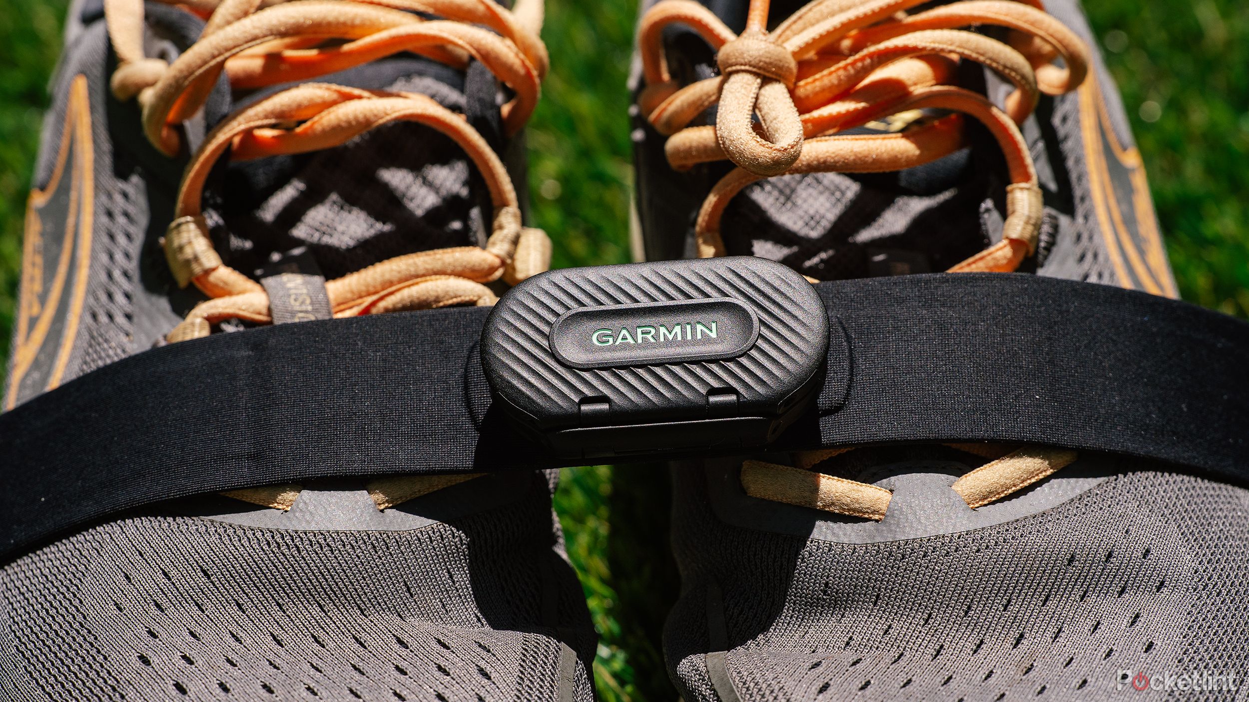 the Garmin HRM-Fit heart rate monitor on a pair of running shoes. 