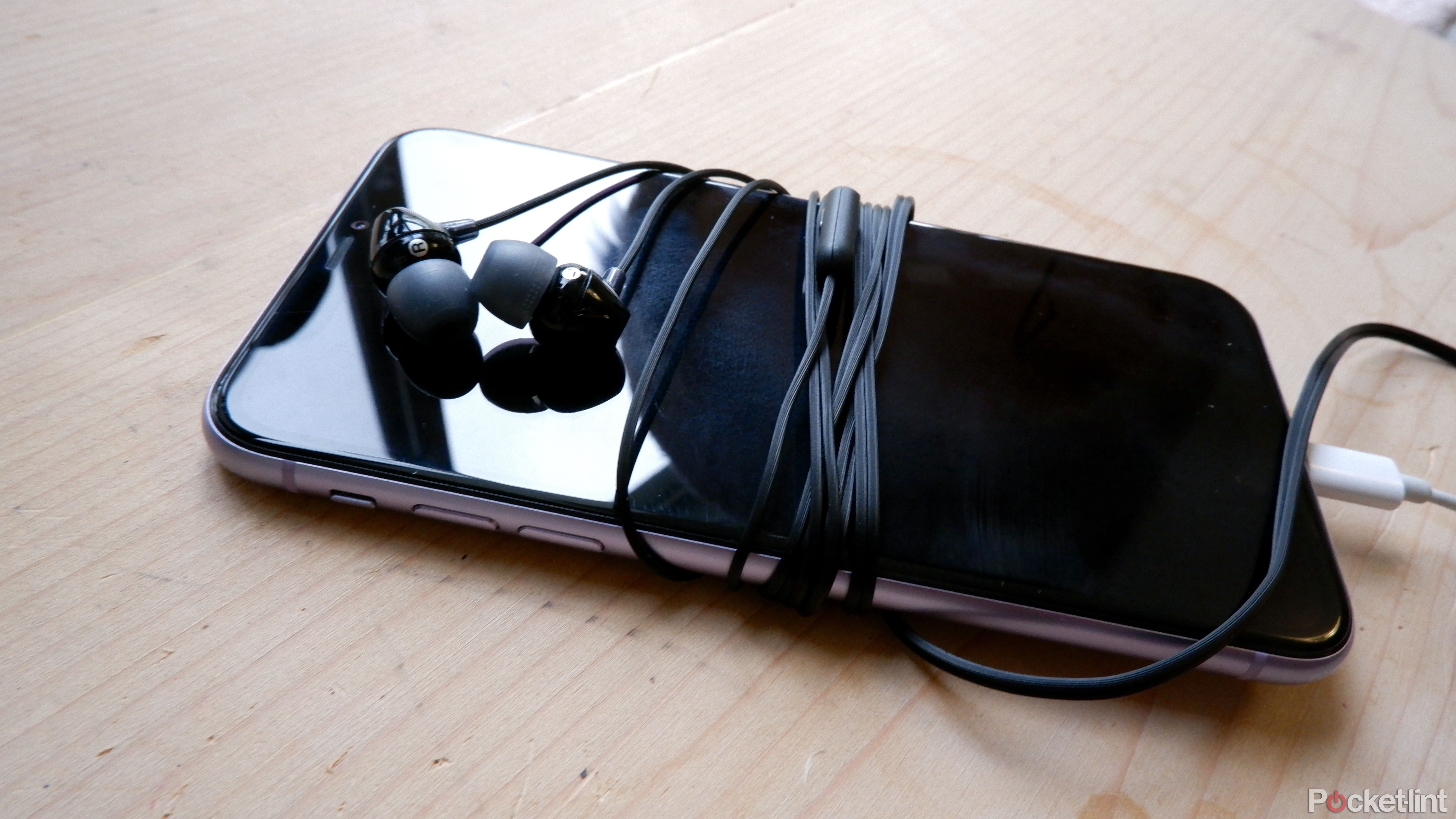 Sony mdr-e15ap earbuds wrapped around a phone