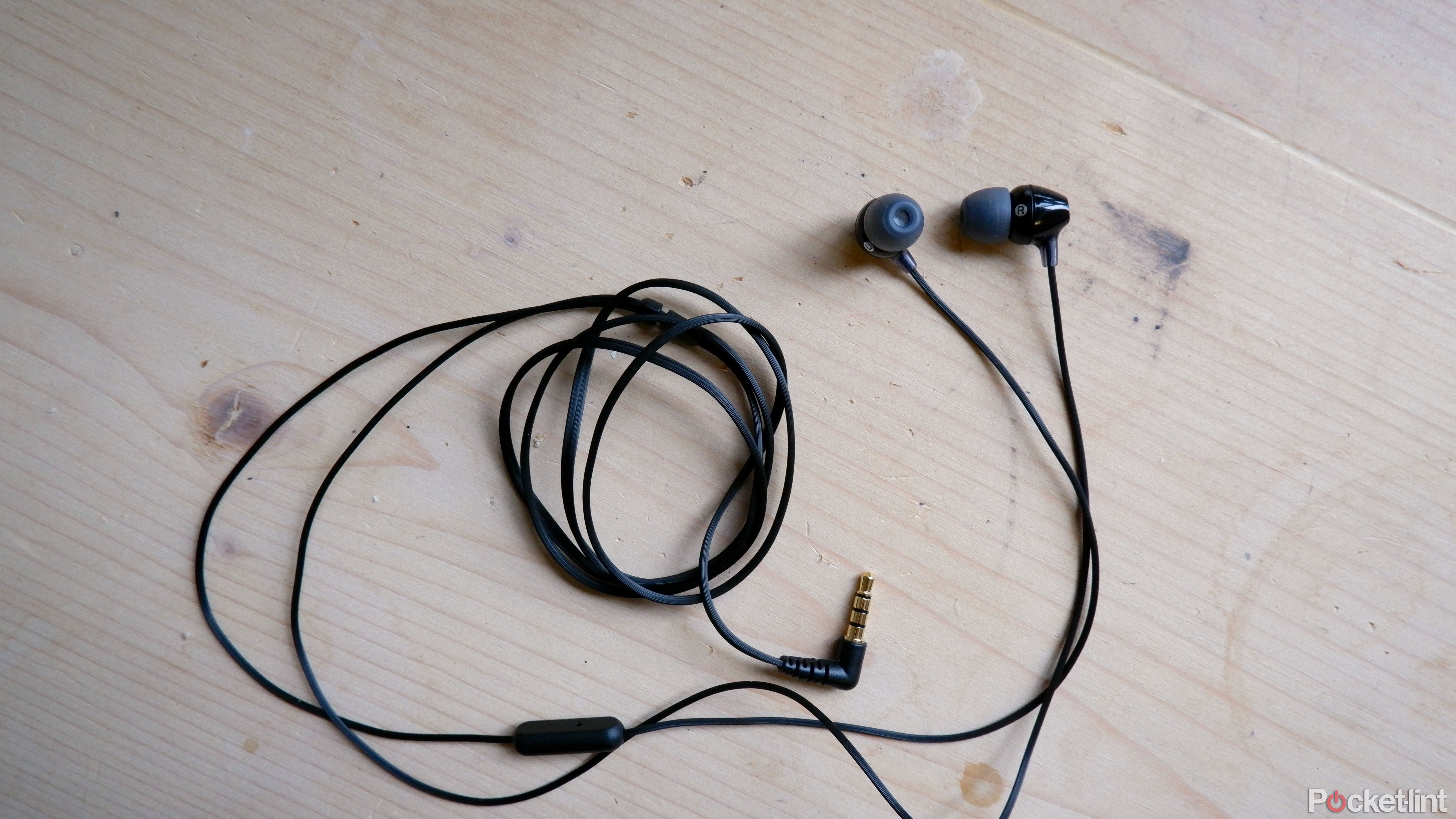sony mdr-ex15ap earbuds on a table