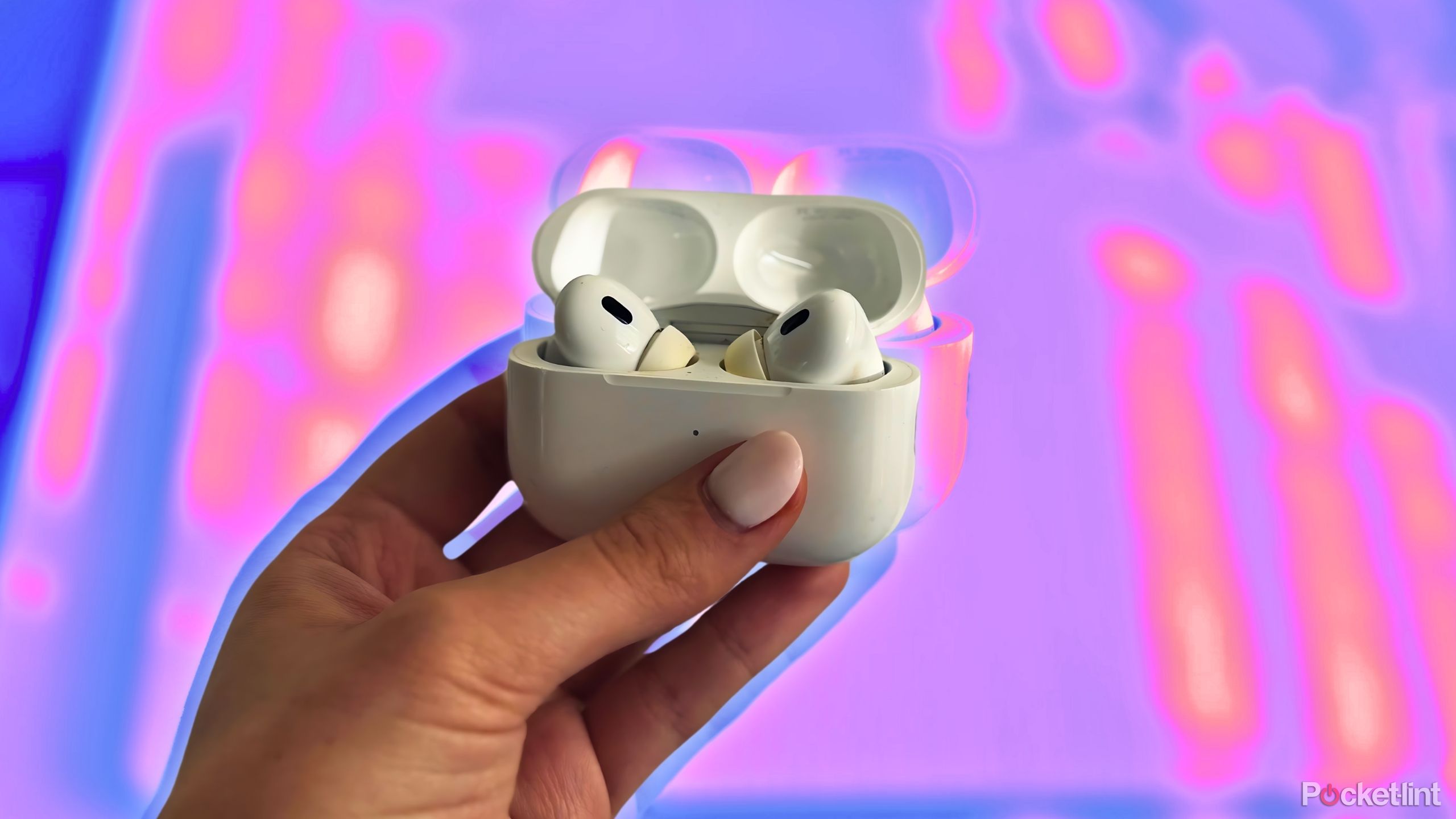Hand holding AirPods Pro 2
