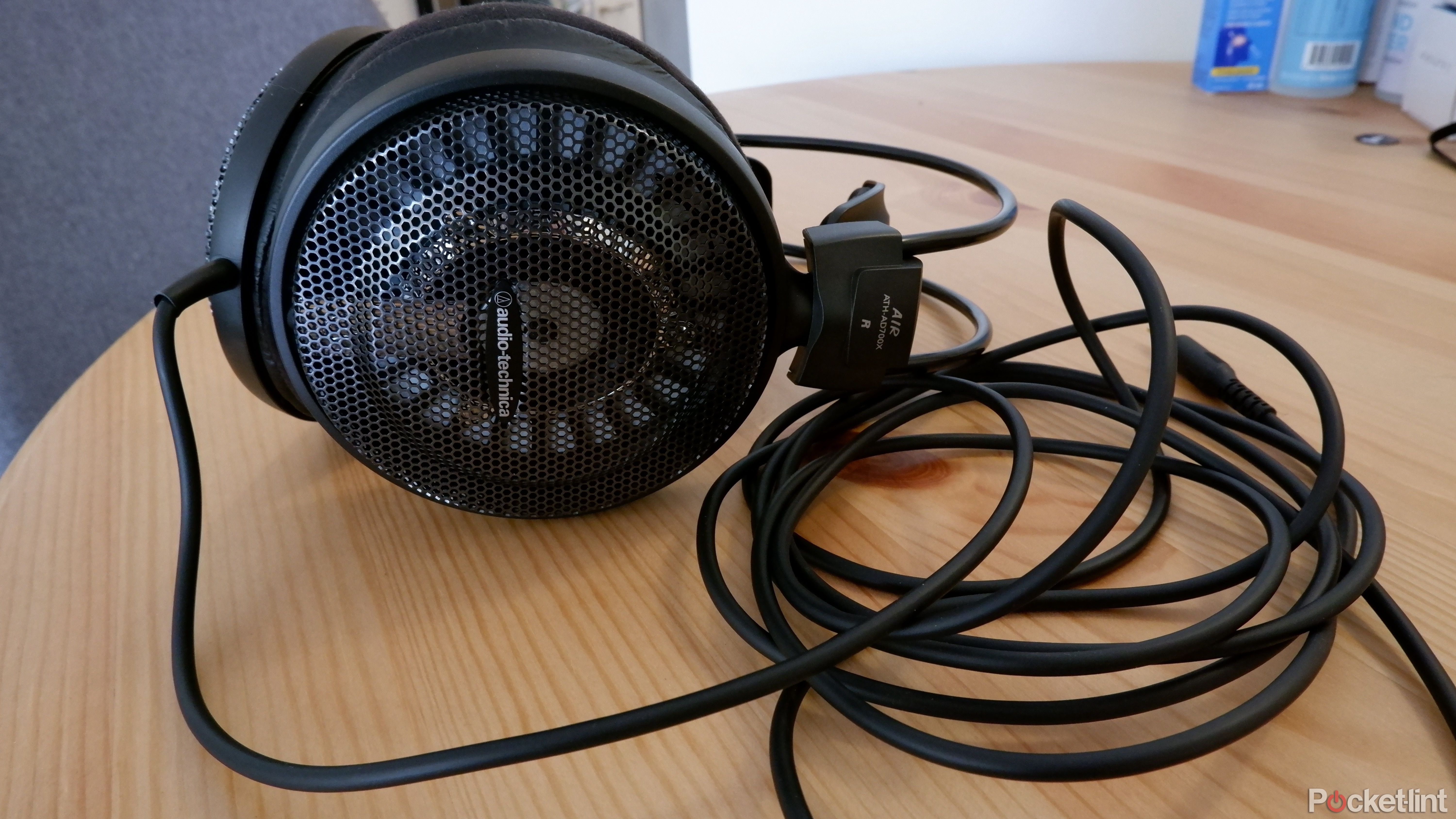 The Audio-Technica ATH-AD700X resting on a wooden table.